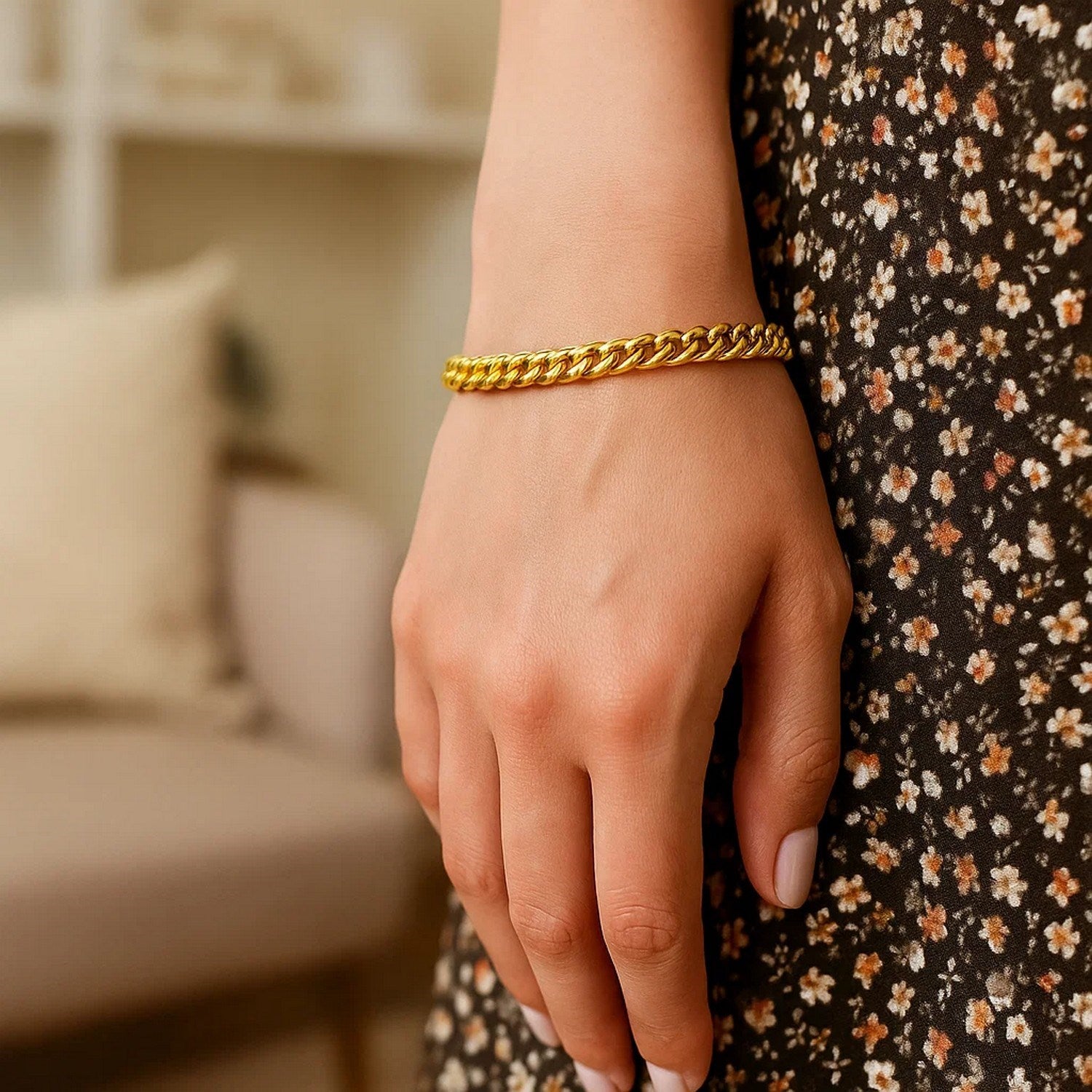 14k yellow gold petite faceted Cuban link chain bracelet, elegantly designed with 4.50 mm links for a luxurious touch.