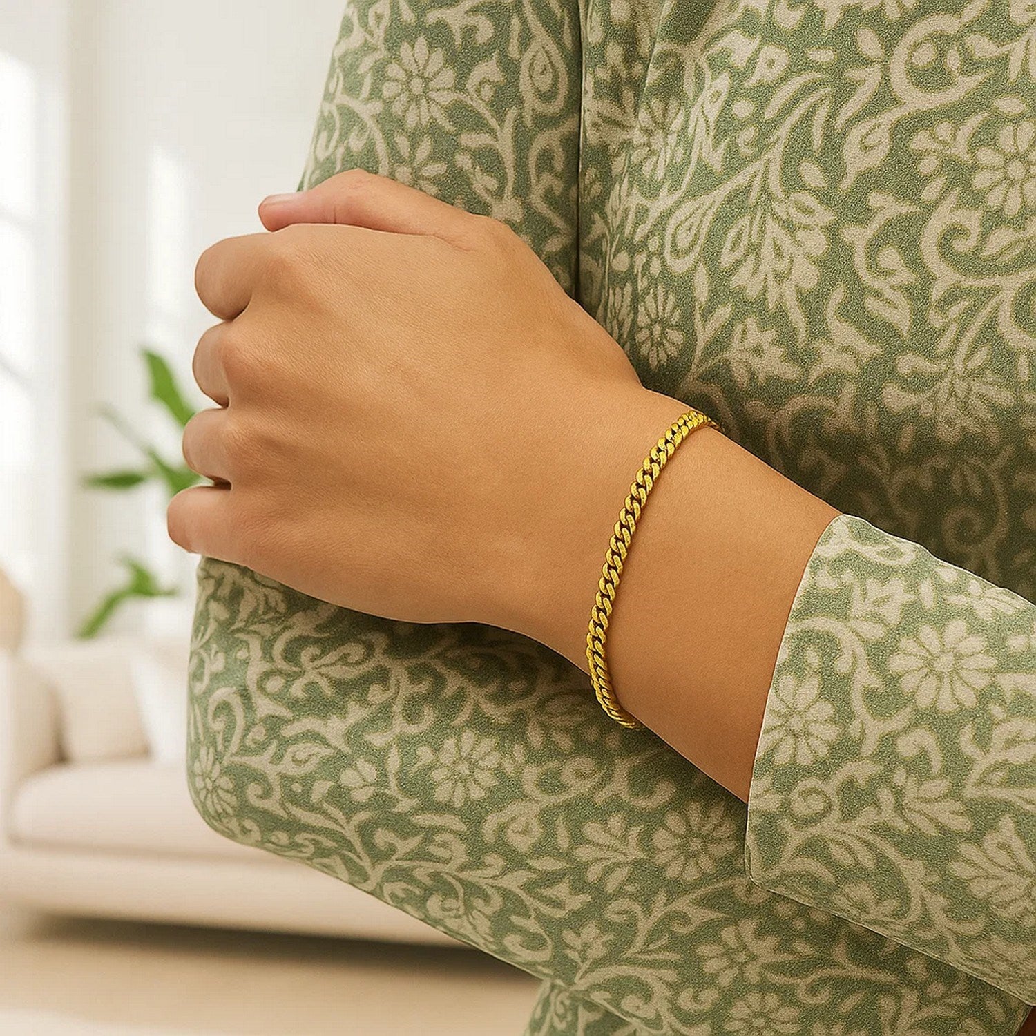 14K yellow gold petite faceted Cuban link chain bracelet, elegant design, 4.50 mm width, perfect for layering or solo wear.