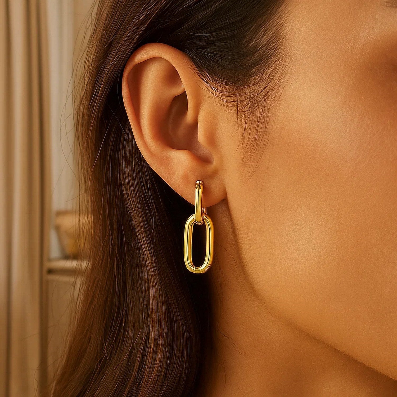 14k yellow gold link drop earrings with a modern design, showcasing elegant movement and refined craftsmanship.