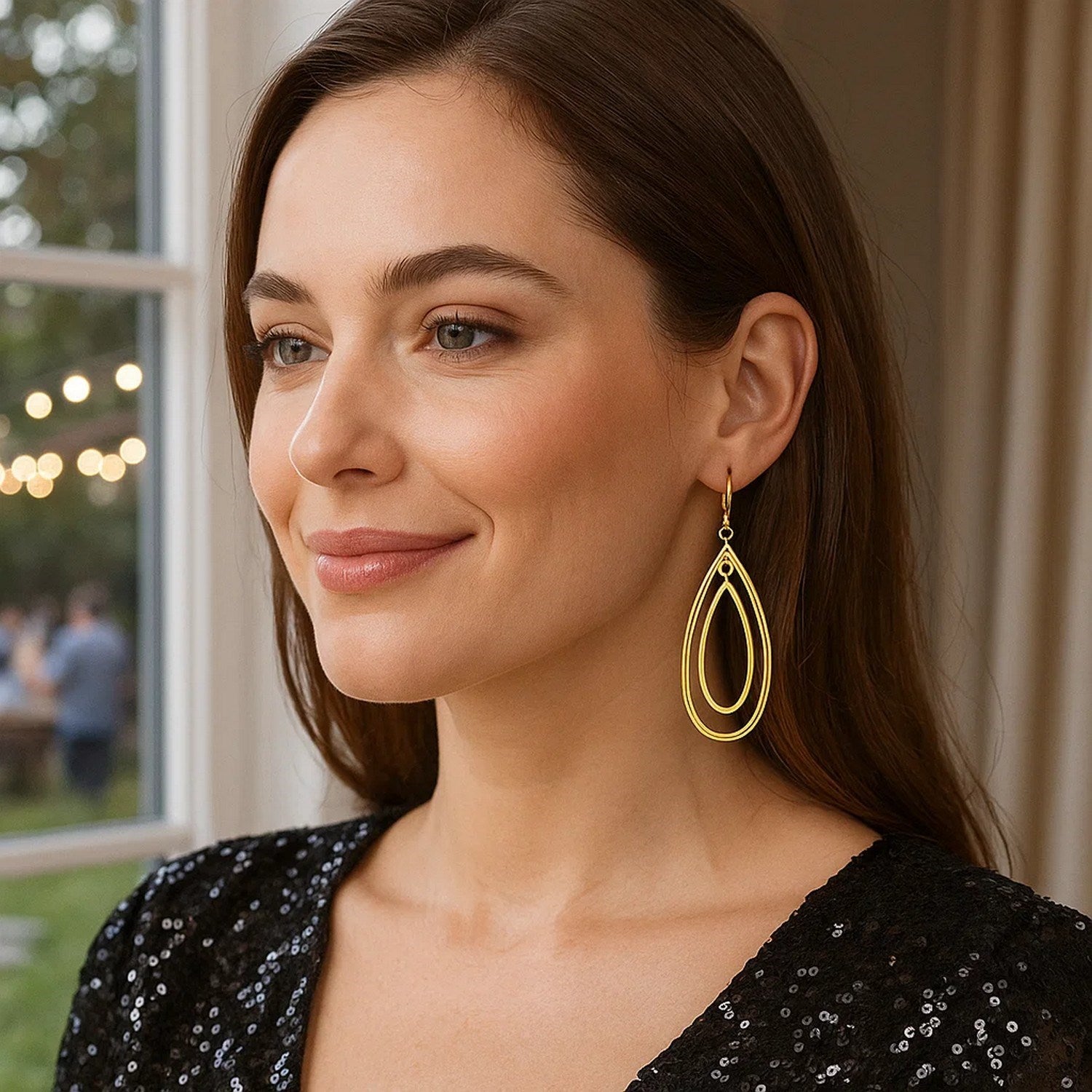 14k yellow gold teardrop dangle earrings featuring an elegant drop design, perfect for sophisticated occasions.
