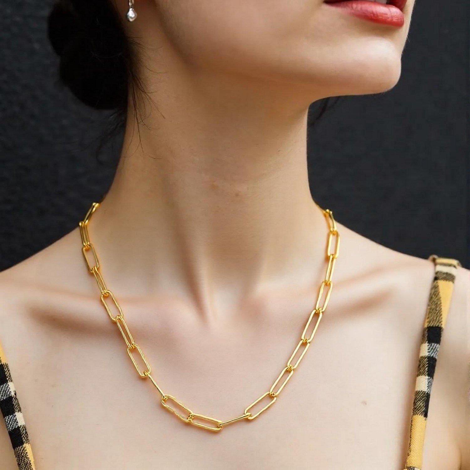 14k yellow gold wide paperclip chain with modern links, showcasing elegance and luxury in every detail.