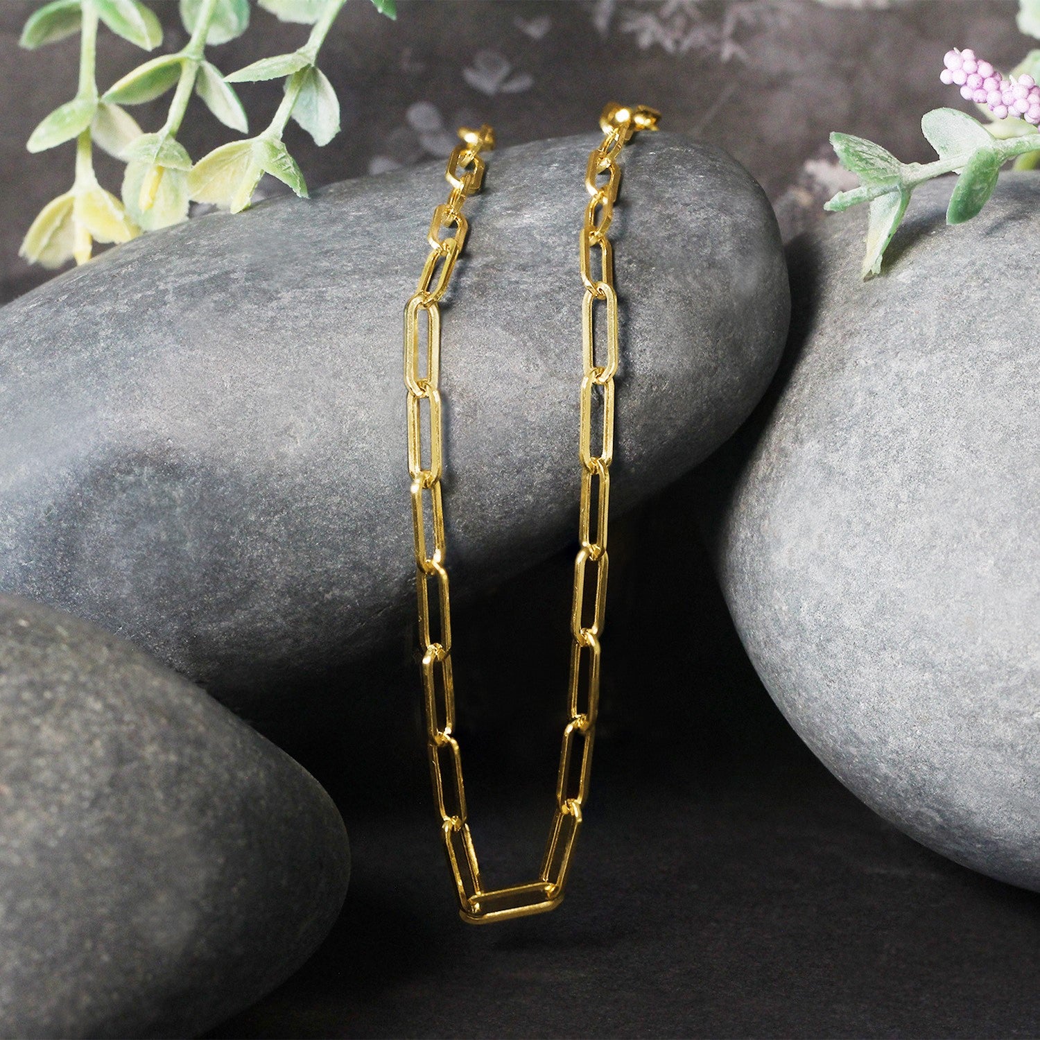 14k yellow gold wide paperclip chain featuring modern links, perfect for layering or wearing solo.