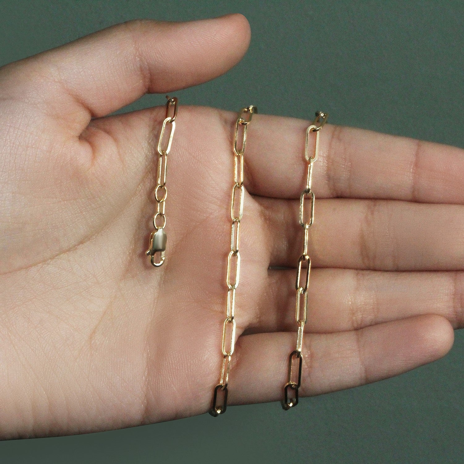 14k yellow gold wide paperclip chain, modern design with elegant links, perfect for layering or standalone wear.
