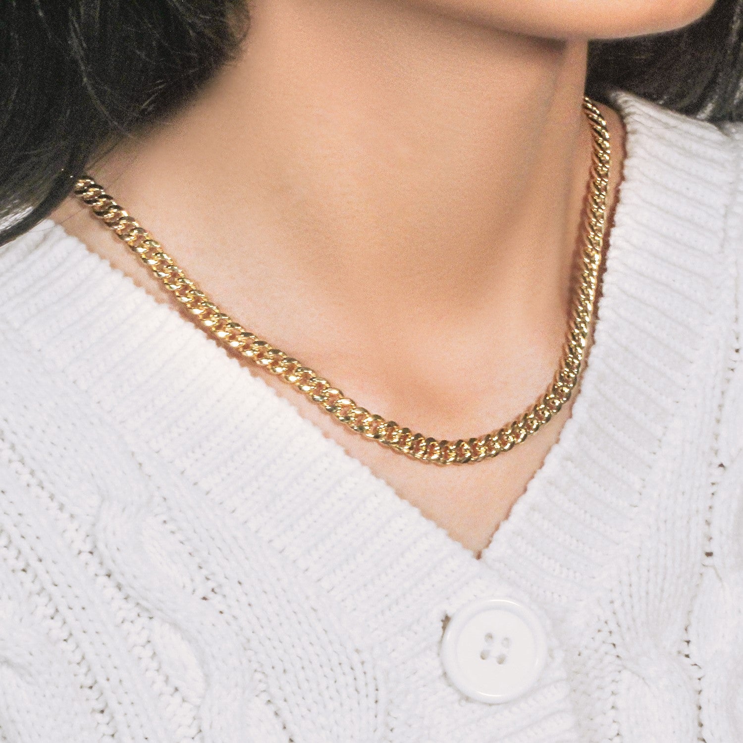 14k yellow gold semi solid Miami Cuban chain, 6.10 mm, showcasing elegant round links for a luxurious statement.
