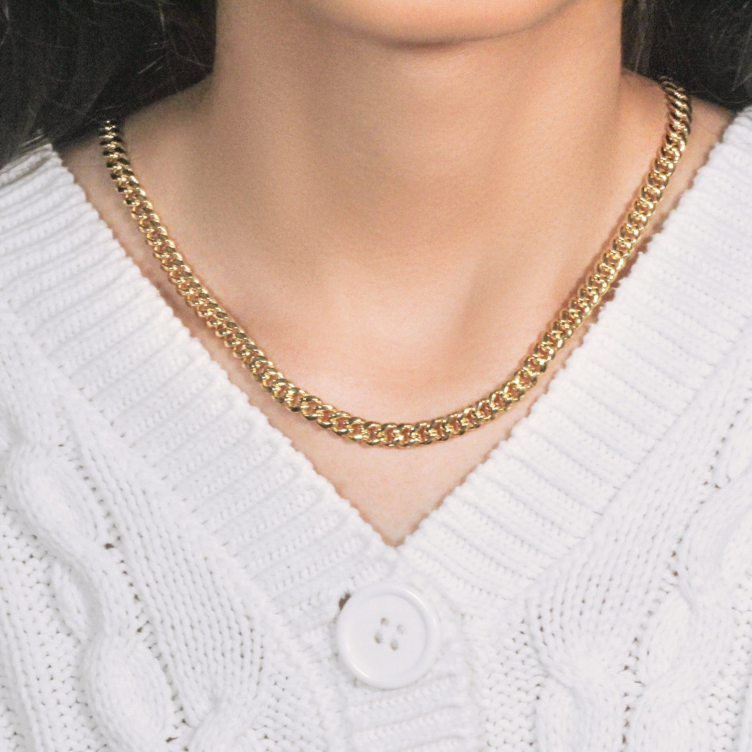 14k yellow gold semi solid Miami Cuban chain, 6.10 mm, showcasing elegant round links for a luxurious statement.