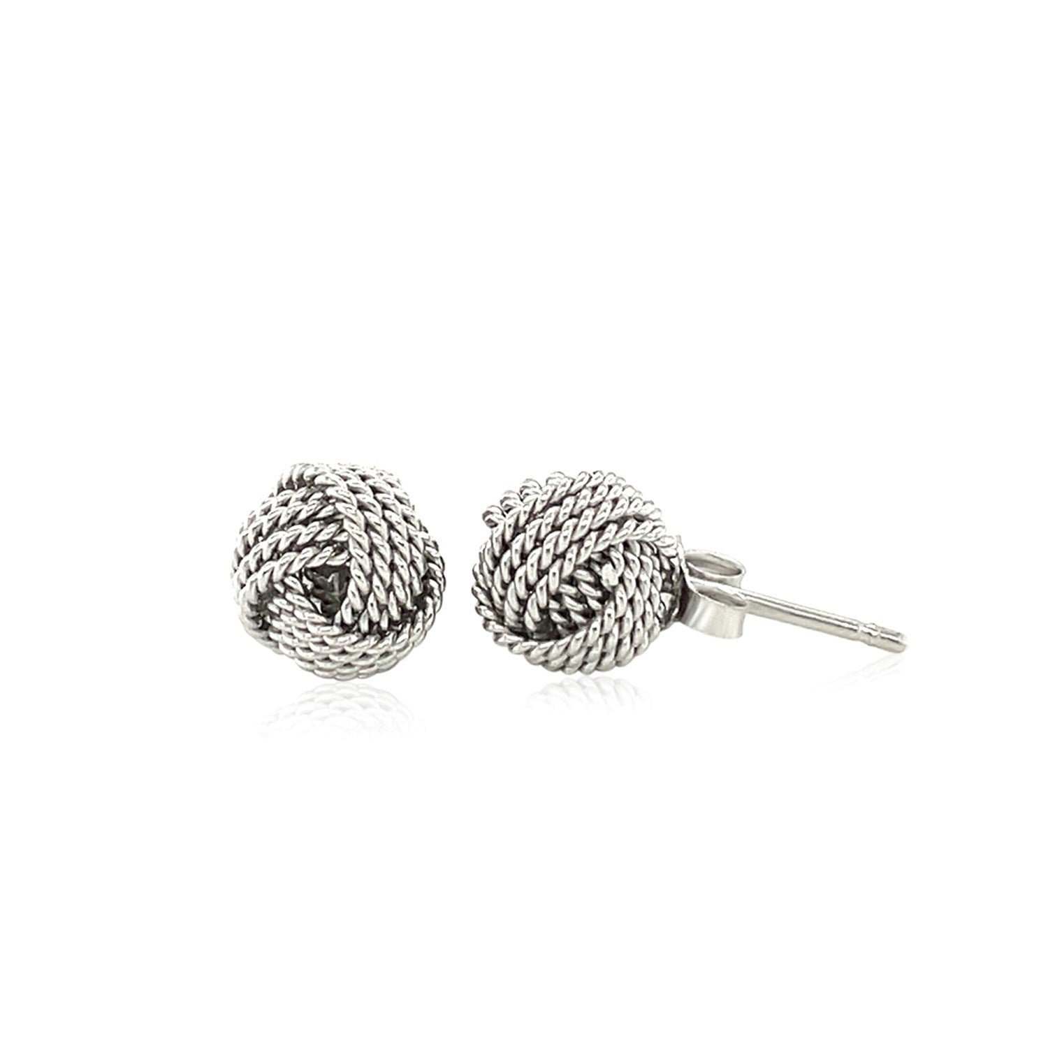 Sterling silver textured love knot stud earrings, elegantly designed for a timeless and sophisticated look.