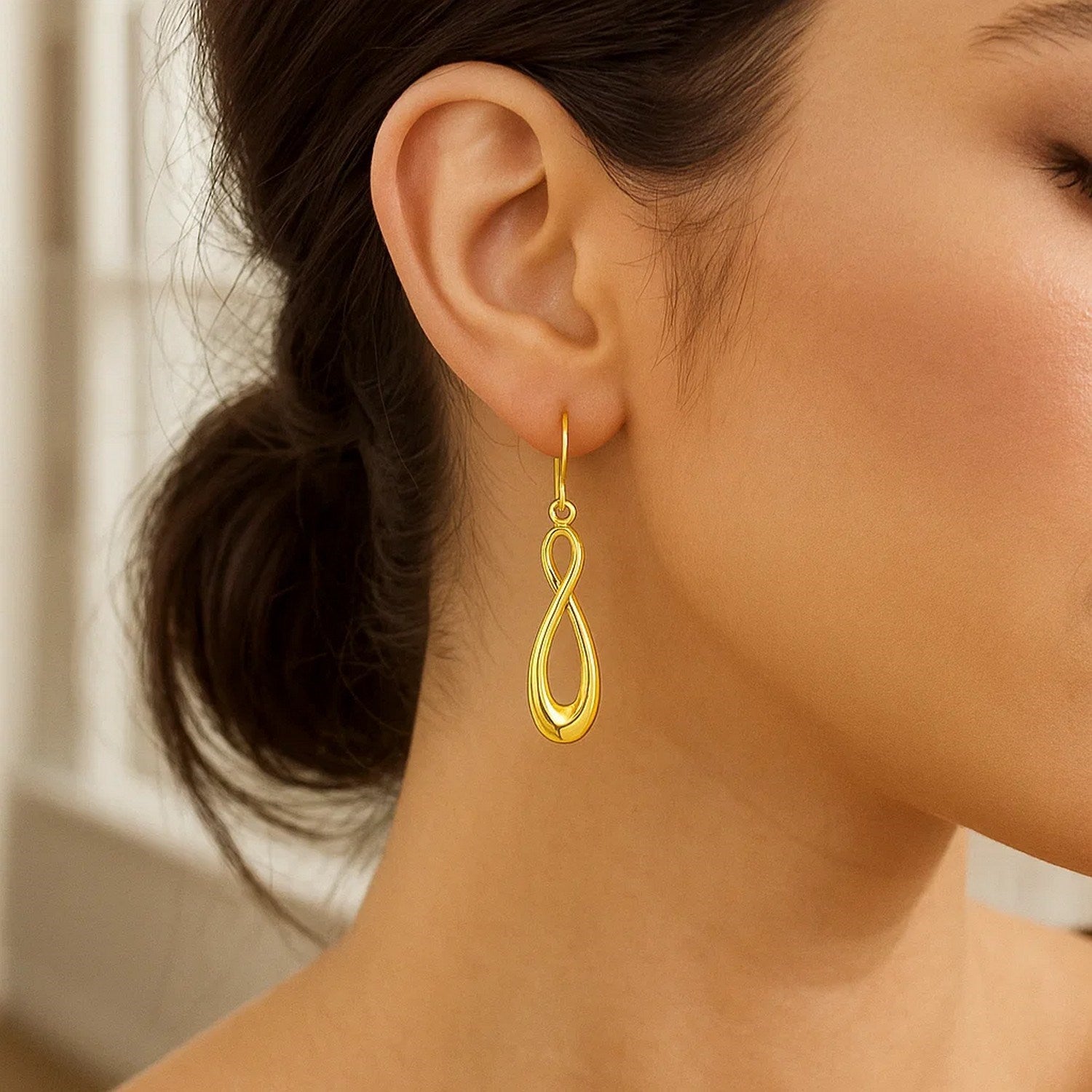 Elegant 14k yellow gold polished hoop earrings showcasing a timeless design for sophisticated style.