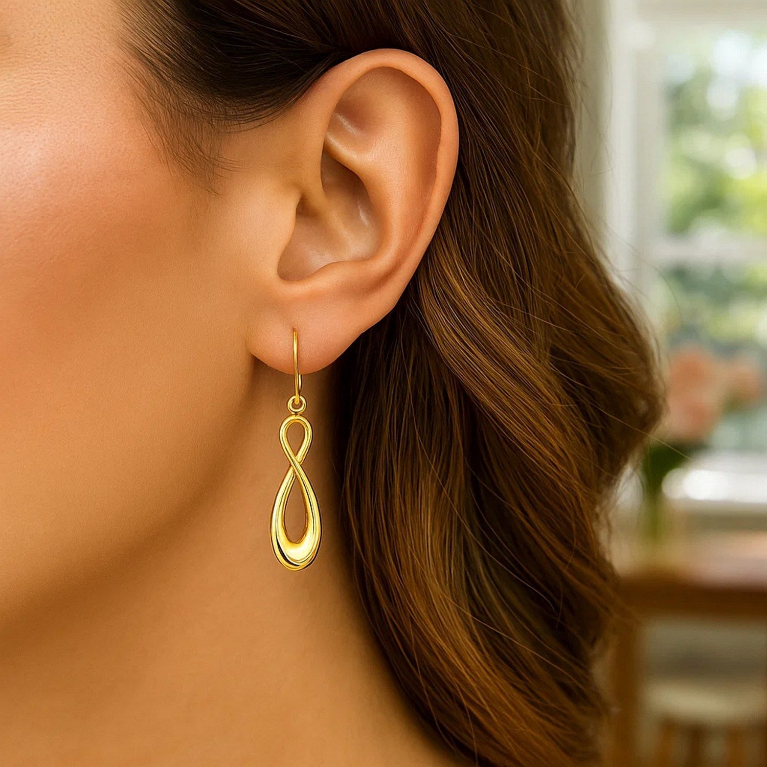 Elegant 14k yellow gold polished hoop earrings showcasing a timeless design for sophisticated style.