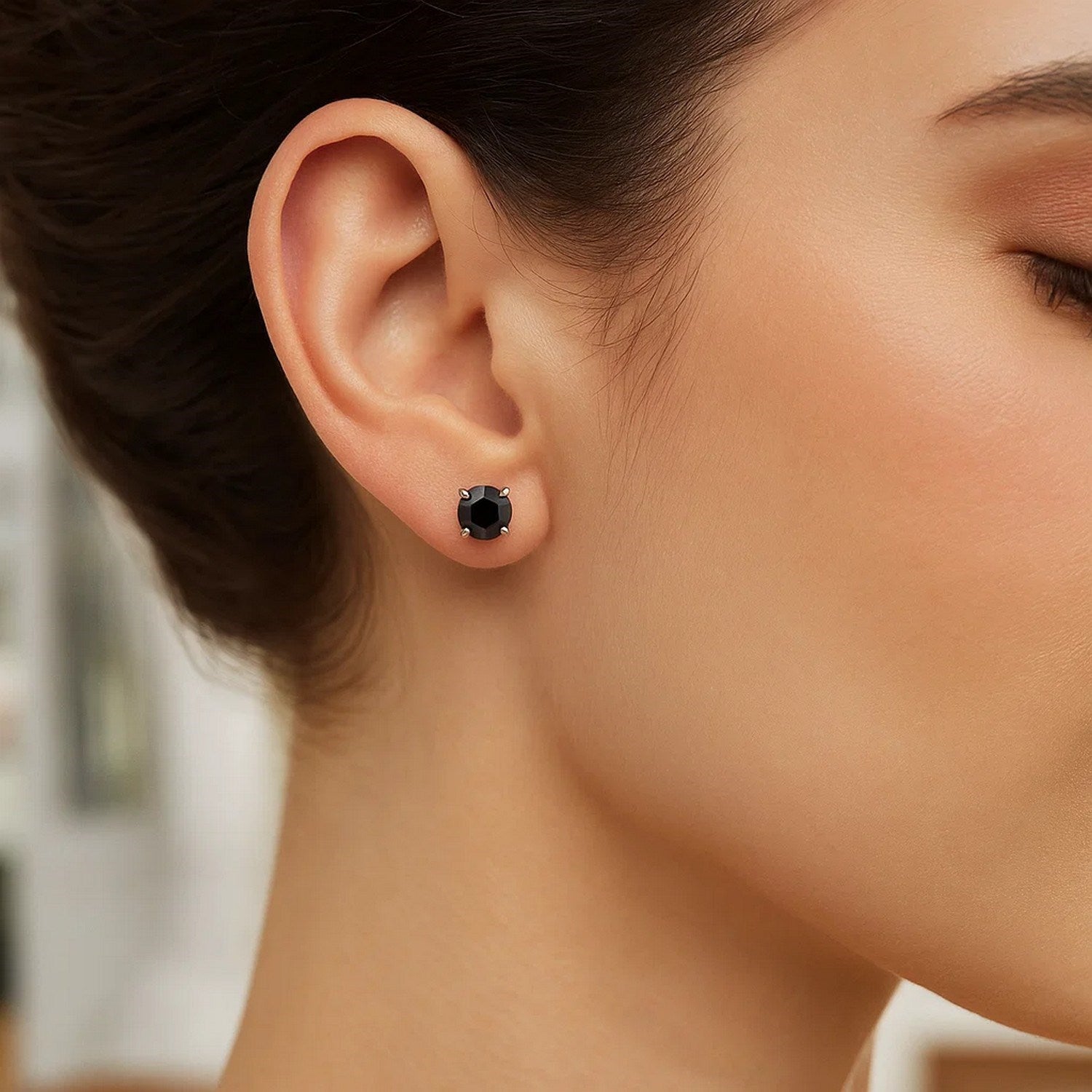 Contemporary 14k white gold stud earrings featuring striking black cubic zirconia for a bold, elegant look.