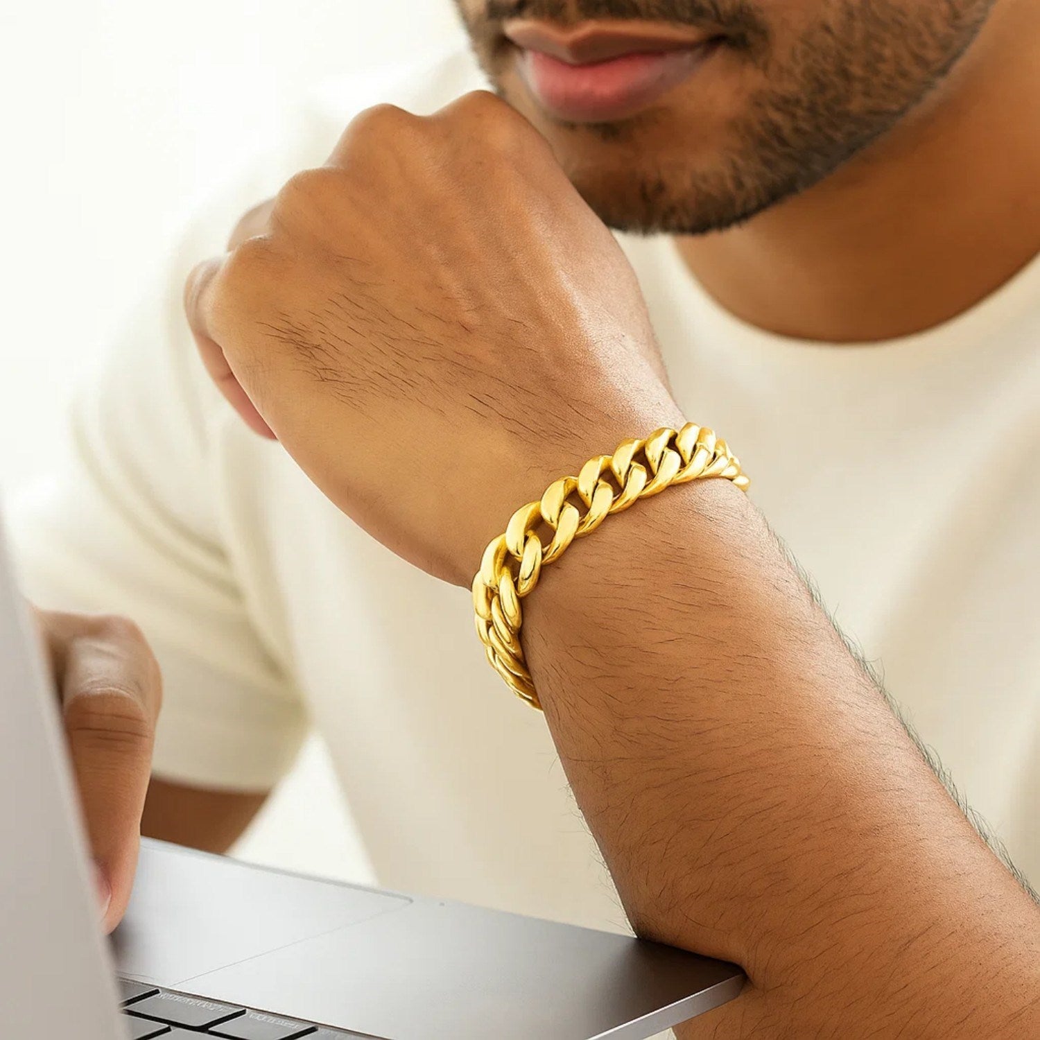 14k yellow gold semi-solid Miami Cuban bracelet with modern link design, showcasing luxury and elegance.