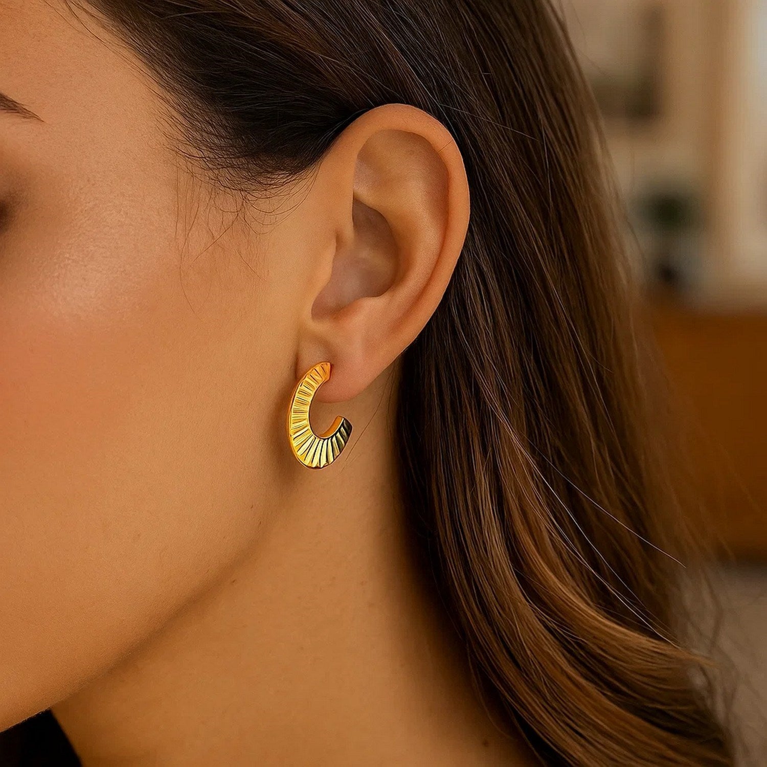 14k yellow gold graduated scalloped half hoop earrings with a modern design, perfect for elegant occasions.