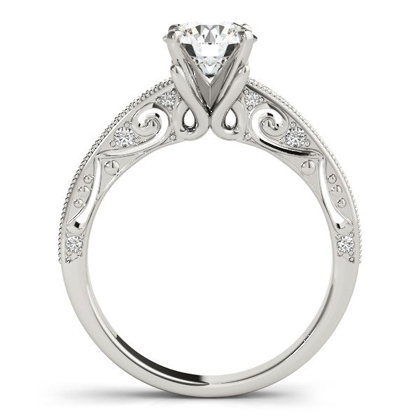 14k white gold vintage engagement ring featuring a prong-set round diamond, showcasing timeless elegance and brilliance.