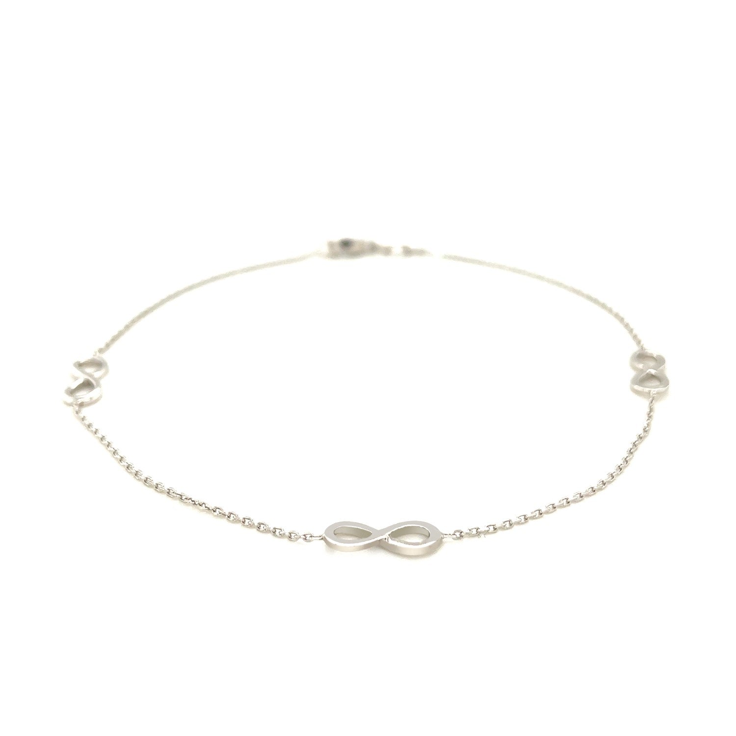 Sterling silver anklet featuring modern infinity symbols on a delicate chain link design.