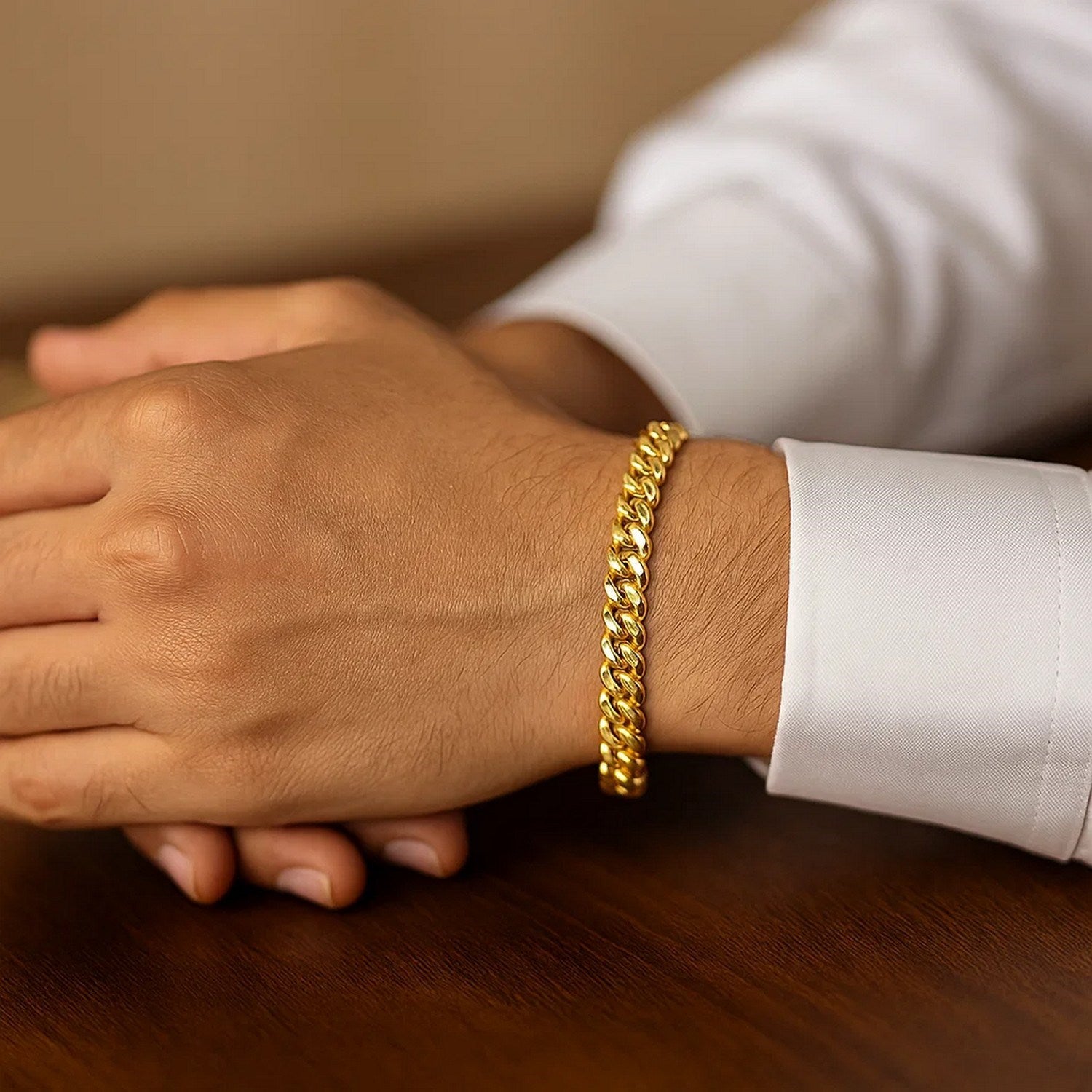 14k yellow gold Miami Cuban bracelet featuring solid links, modern design, and a luxurious shine.