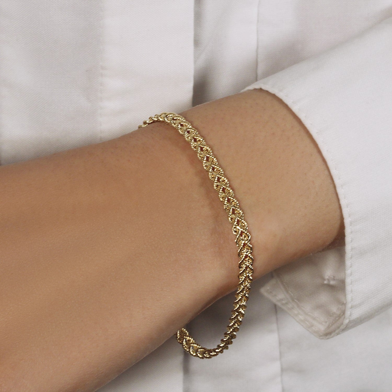 Classic double rope chain bracelet in 14k yellow gold, featuring elegant links and a timeless design.