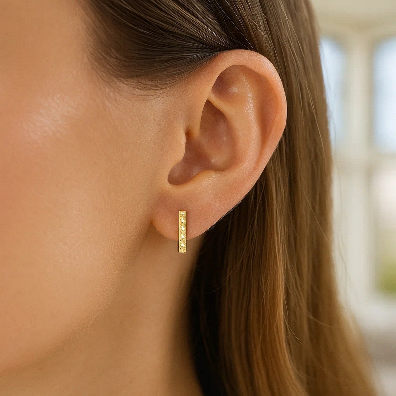 14k yellow gold textured bar drop earrings showcasing modern elegance and refined craftsmanship.
