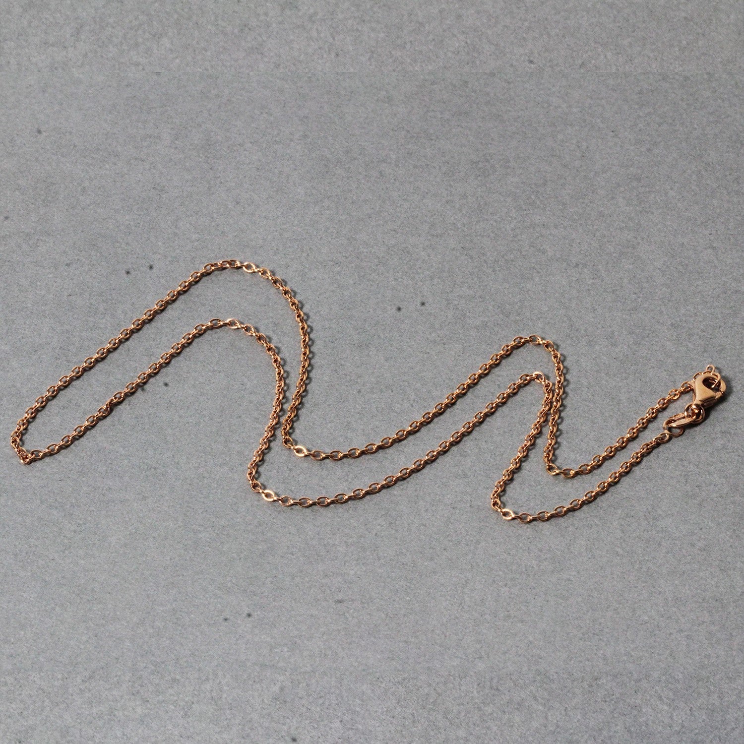 14k rose gold round cable link chain, modern design with elegant links, perfect for layering or standalone wear.