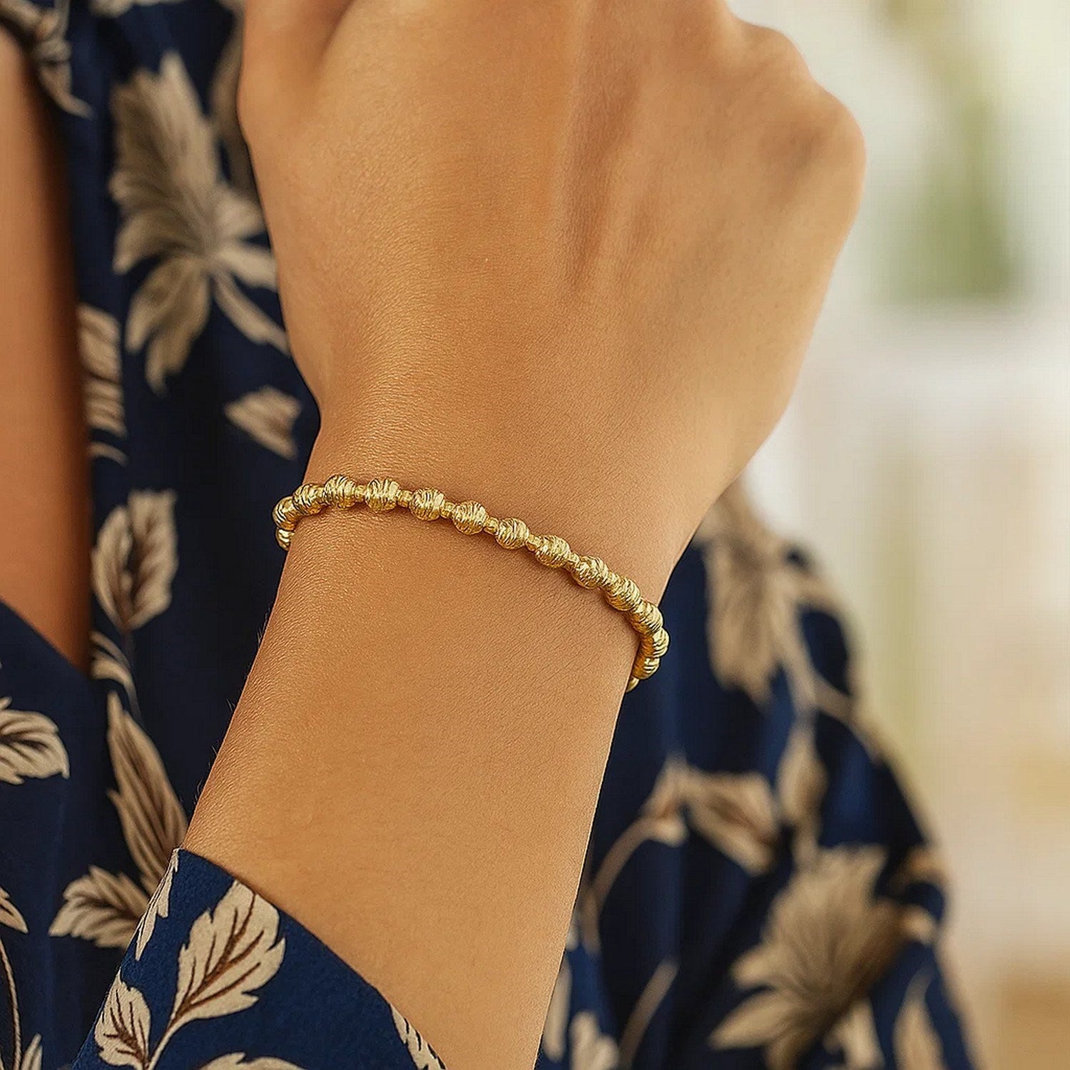 14k yellow gold disco diamond cut bead bracelet featuring elegant design and luxurious finish, perfect for any occasion.