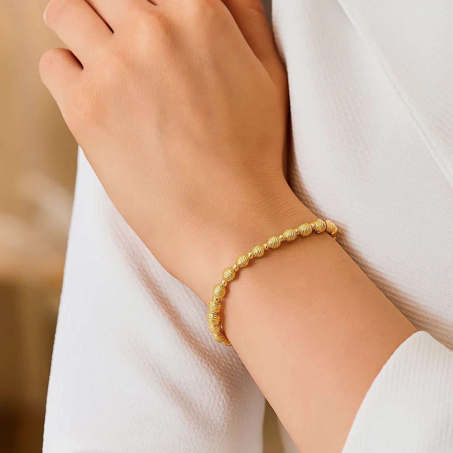 14K yellow gold disco diamond cut bead bracelet, 4.00 mm, showcasing elegant luxury and exquisite craftsmanship.