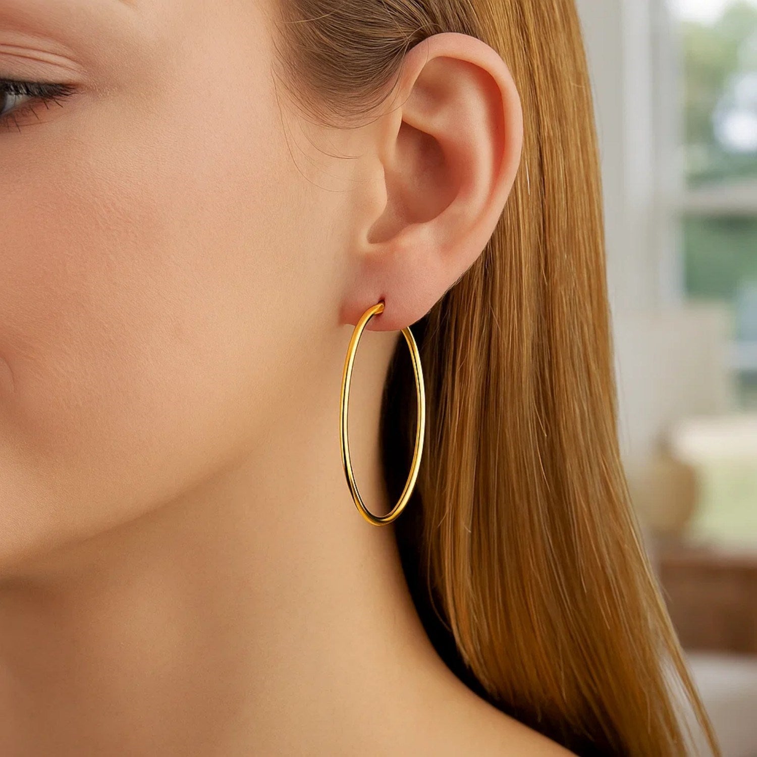14k yellow gold polished hoop earrings with modern stud design, elegantly crafted for a luxurious statement.