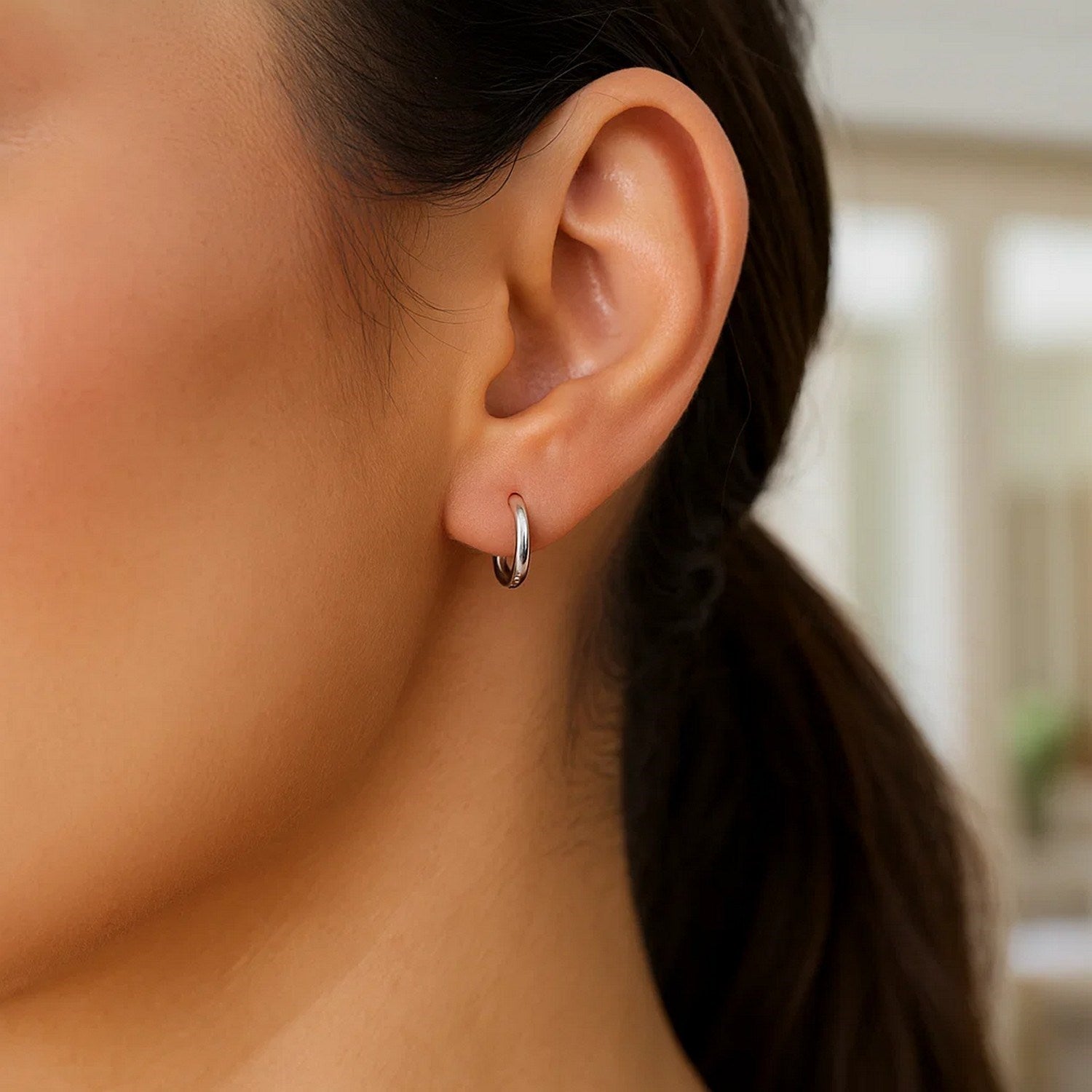 Sterling silver rhodium plated polished hoop earrings showcasing a modern design for elegant sophistication.