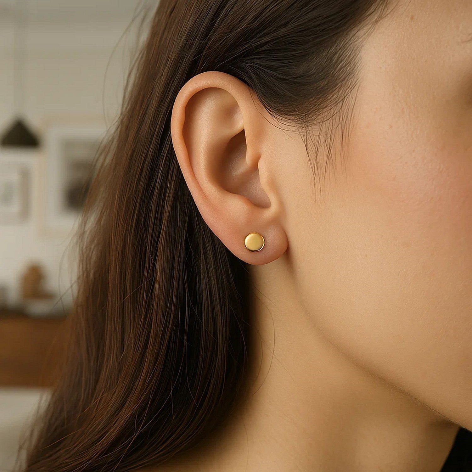 14k yellow gold polished round post earrings with a sleek modern design, perfect for elegant everyday wear.