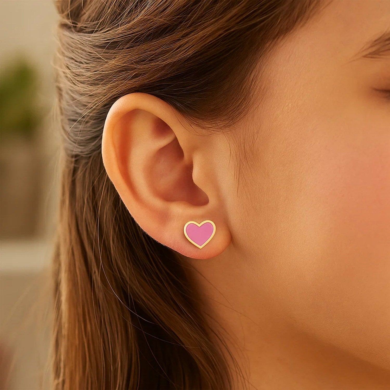14k yellow gold stud earrings featuring modern pink enamel heart design, perfect for a chic, luxurious look.