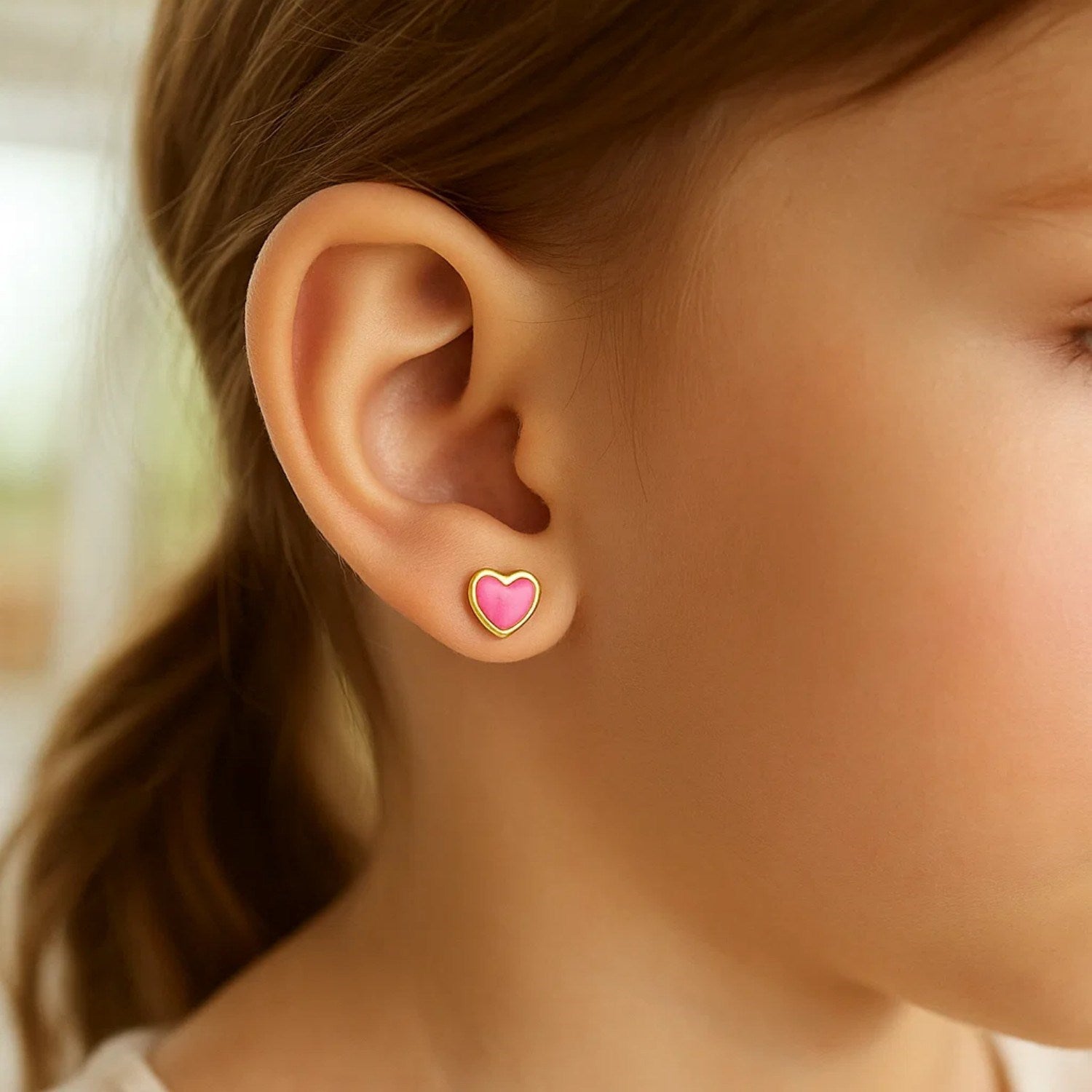 14k yellow gold modern stud earrings featuring vibrant pink enamel heart design for a chic, luxurious touch.