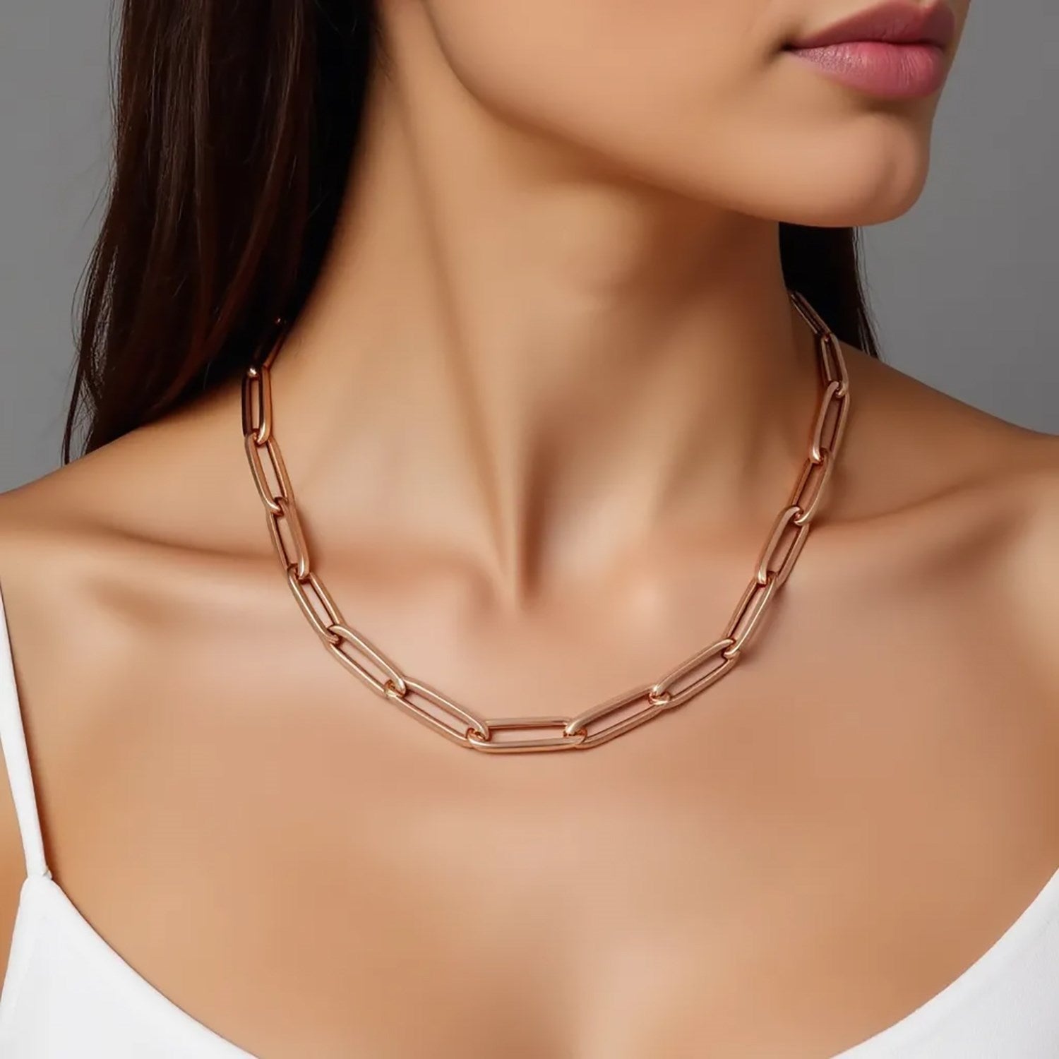 14K rose gold wide paperclip chain featuring modern links, perfect for layering or as a statement piece.