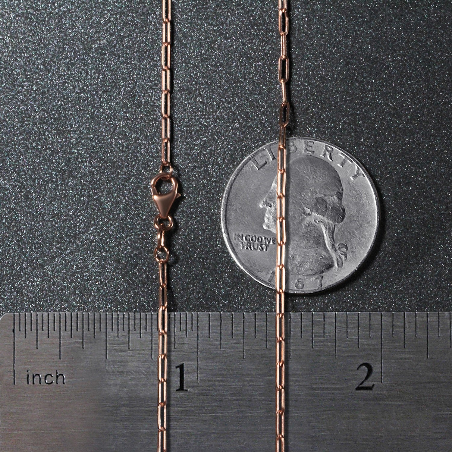14K rose gold fine paperclip chain featuring modern links, perfect for layering or as a statement piece.