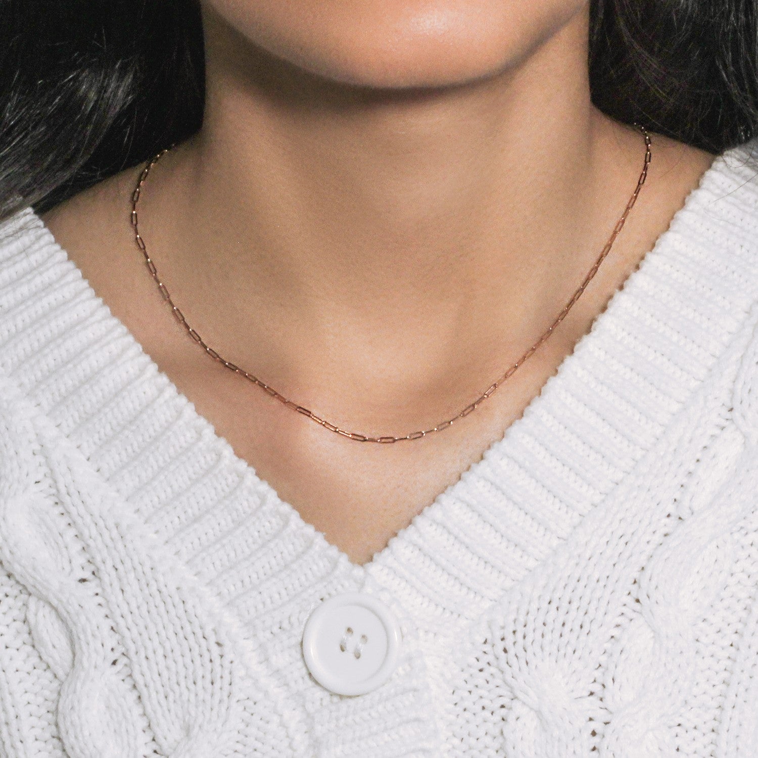 14k rose gold fine paperclip chain with modern links, perfect for layering or wearing solo as a statement piece.