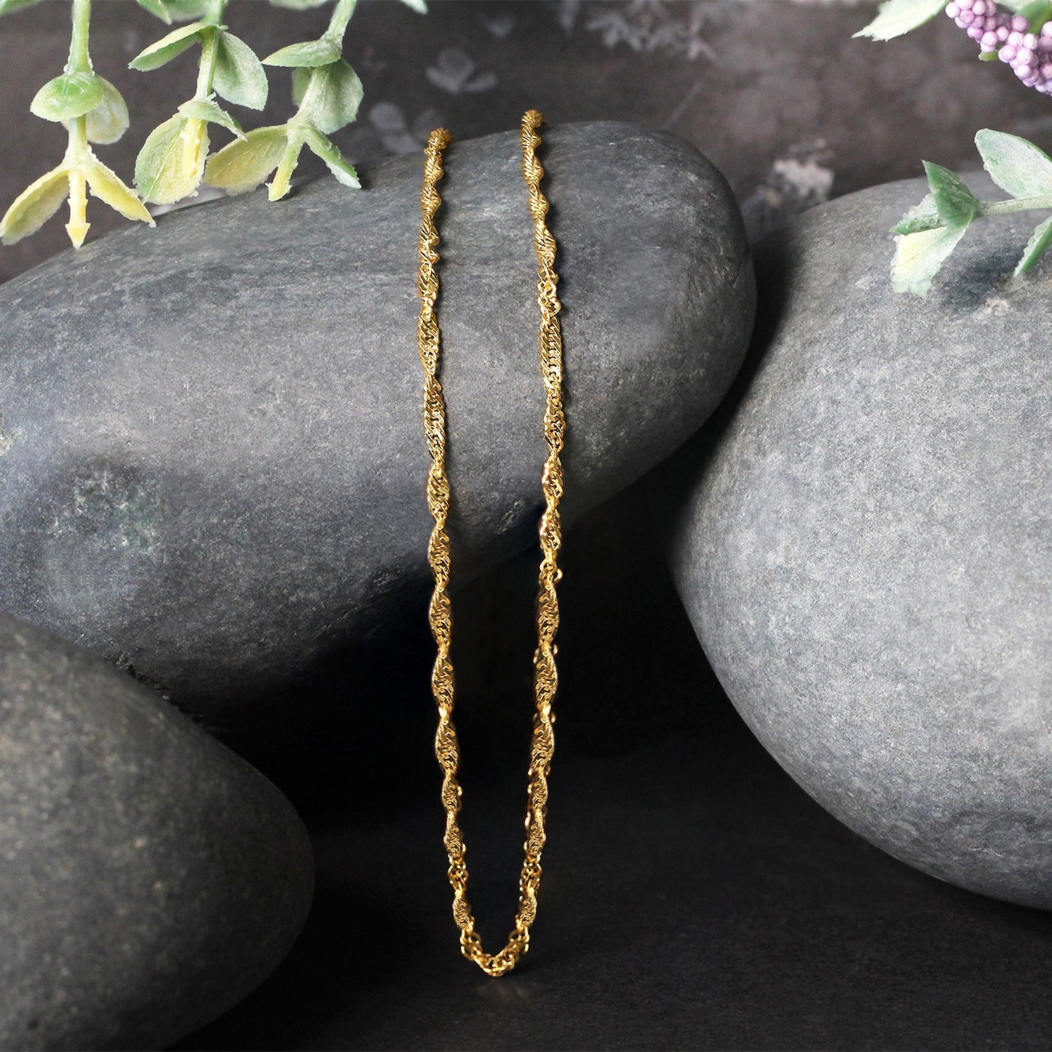 Elegant 14k yellow gold Singapore chain, 1.80 mm, showcasing a refined design perfect for layering or standalone wear.