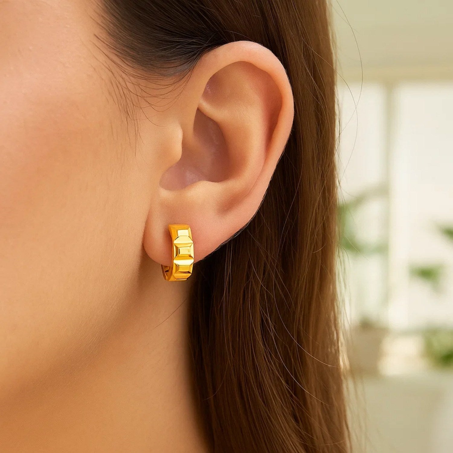 14k yellow gold modern J hoop earrings showcasing a sleek, elegant design for a luxurious look.