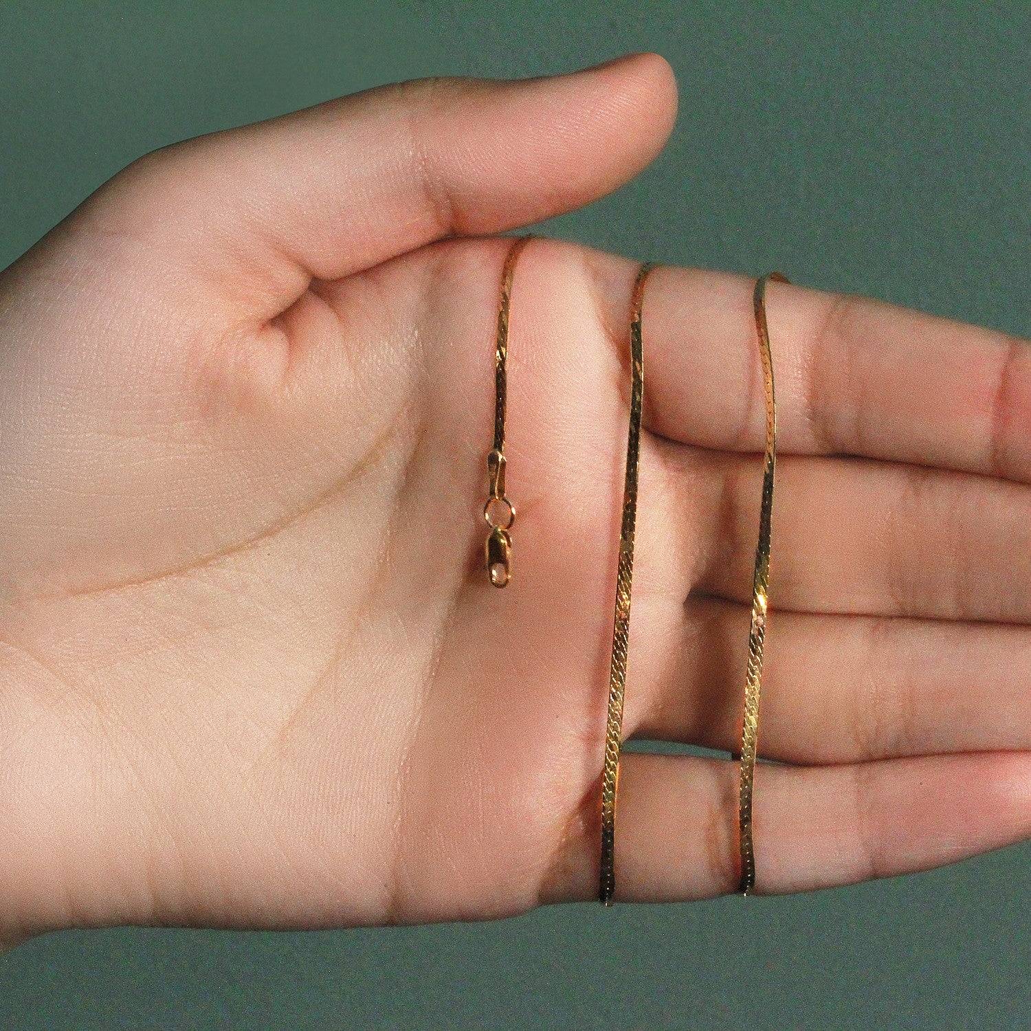 14k yellow gold super flex herringbone chain, 1.50 mm, elegant design with a luxurious shine and smooth finish.