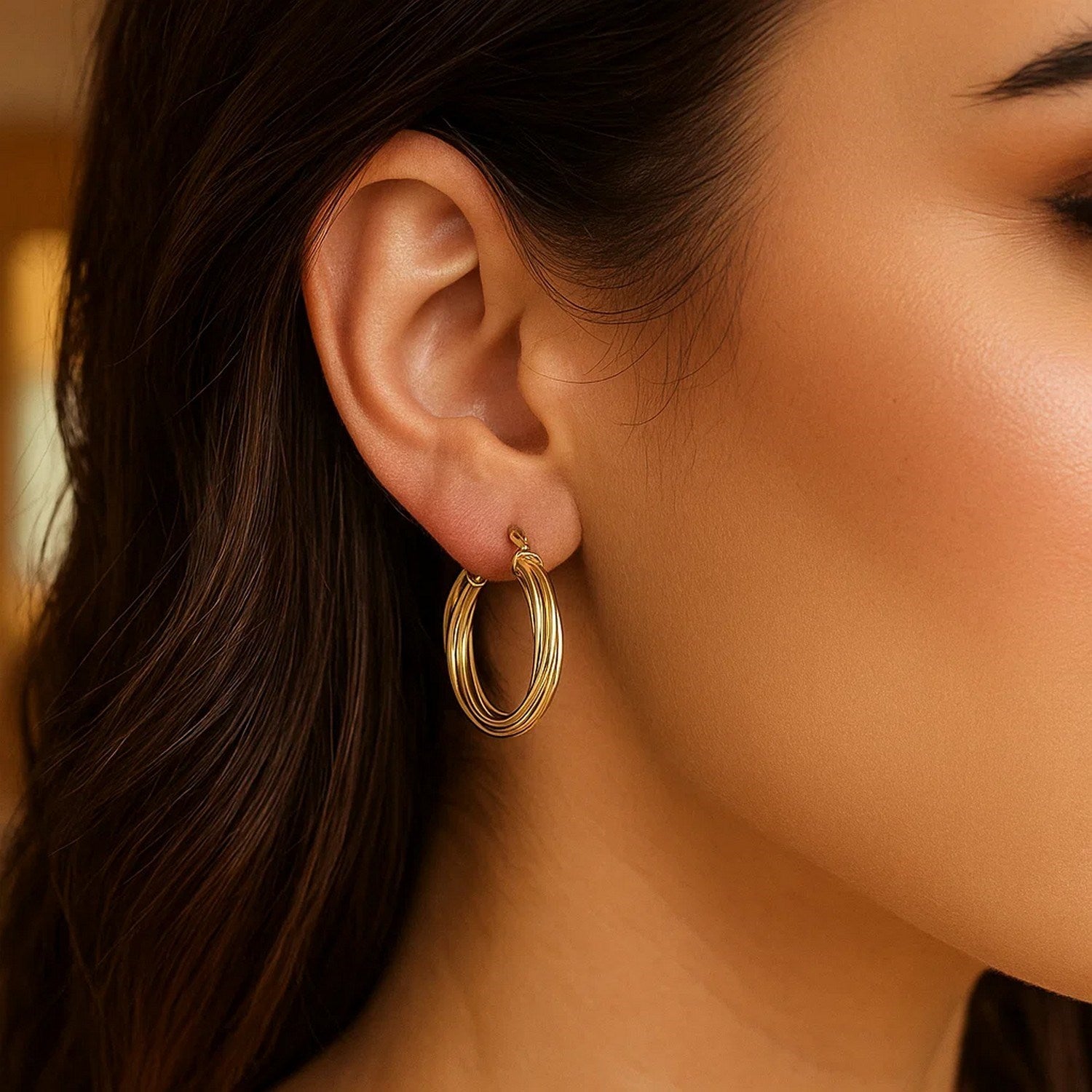 Elegant 14k yellow gold polished hoop earrings showcasing a timeless design and luxurious shine.