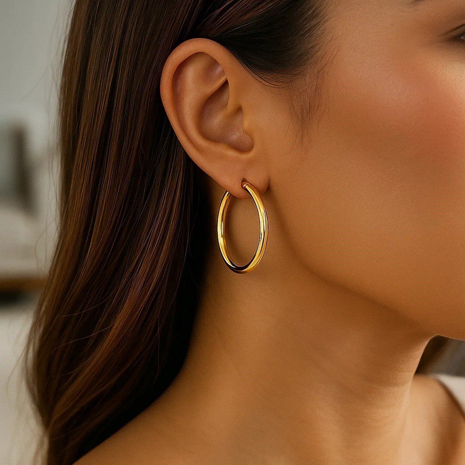 14k yellow gold polished hoop earrings, modern design, 30mm diameter, perfect for elegant everyday wear.