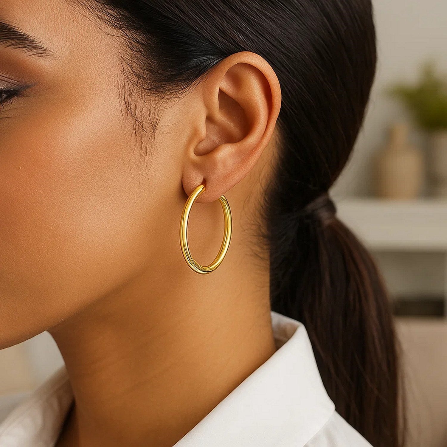 14k yellow gold polished hoop earrings, modern design, elegant 3x30mm size for a luxurious touch.