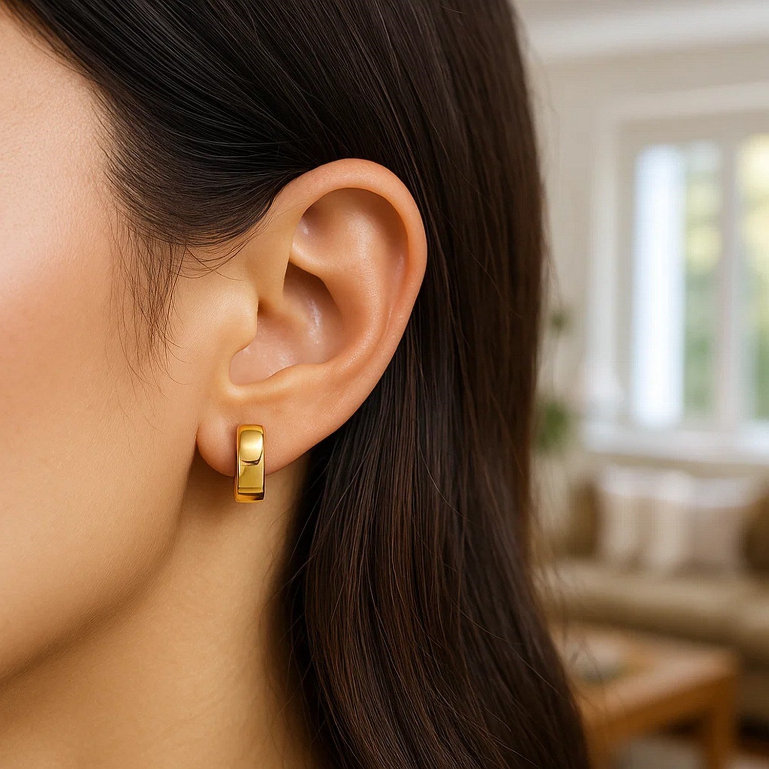 14k yellow gold contemporary hoop earrings with a sleek, snuggable design for effortless elegance.