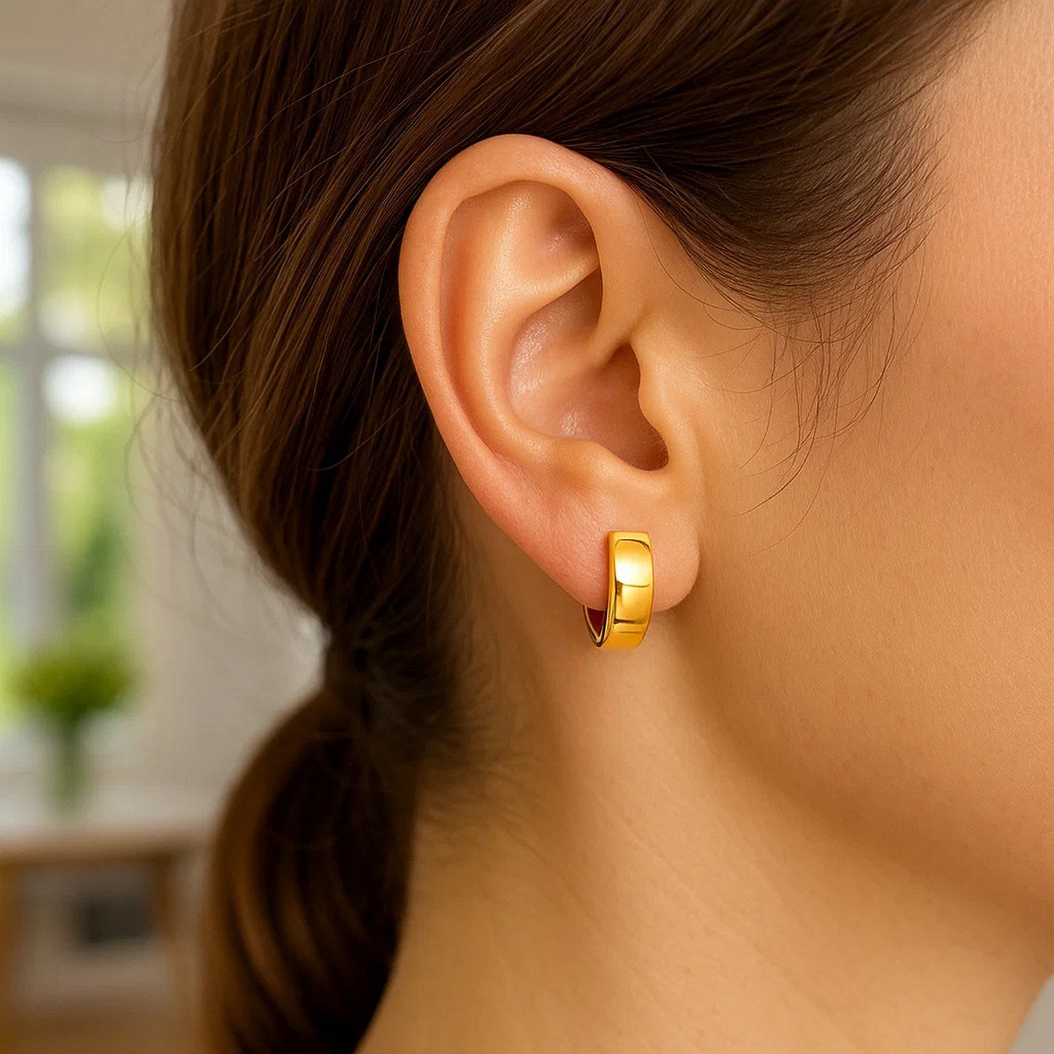 14k yellow gold contemporary hoop earrings with a sleek, snuggable design for effortless elegance.
