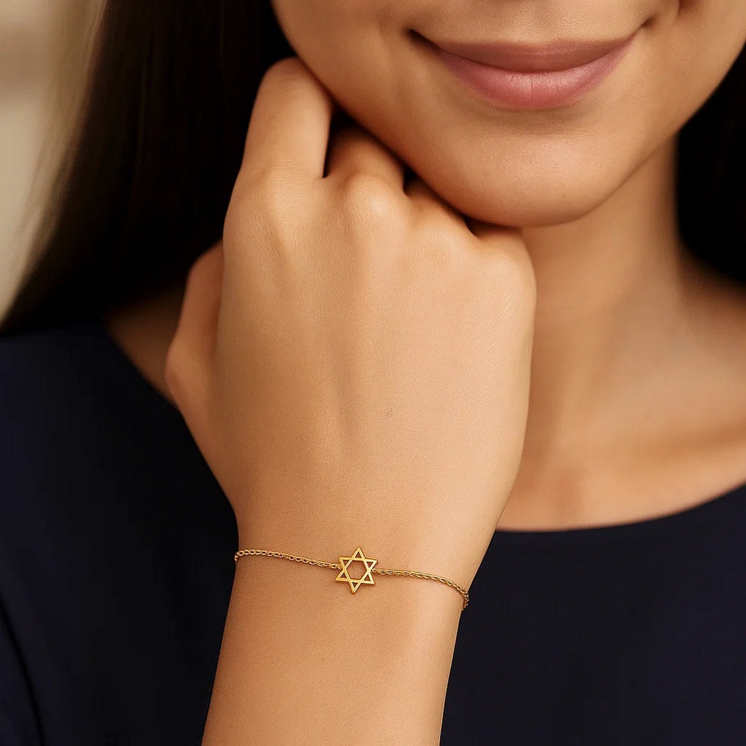 Elegant 14k yellow gold Star of David bracelet with a delicate chain design, perfect for luxury jewelry enthusiasts.