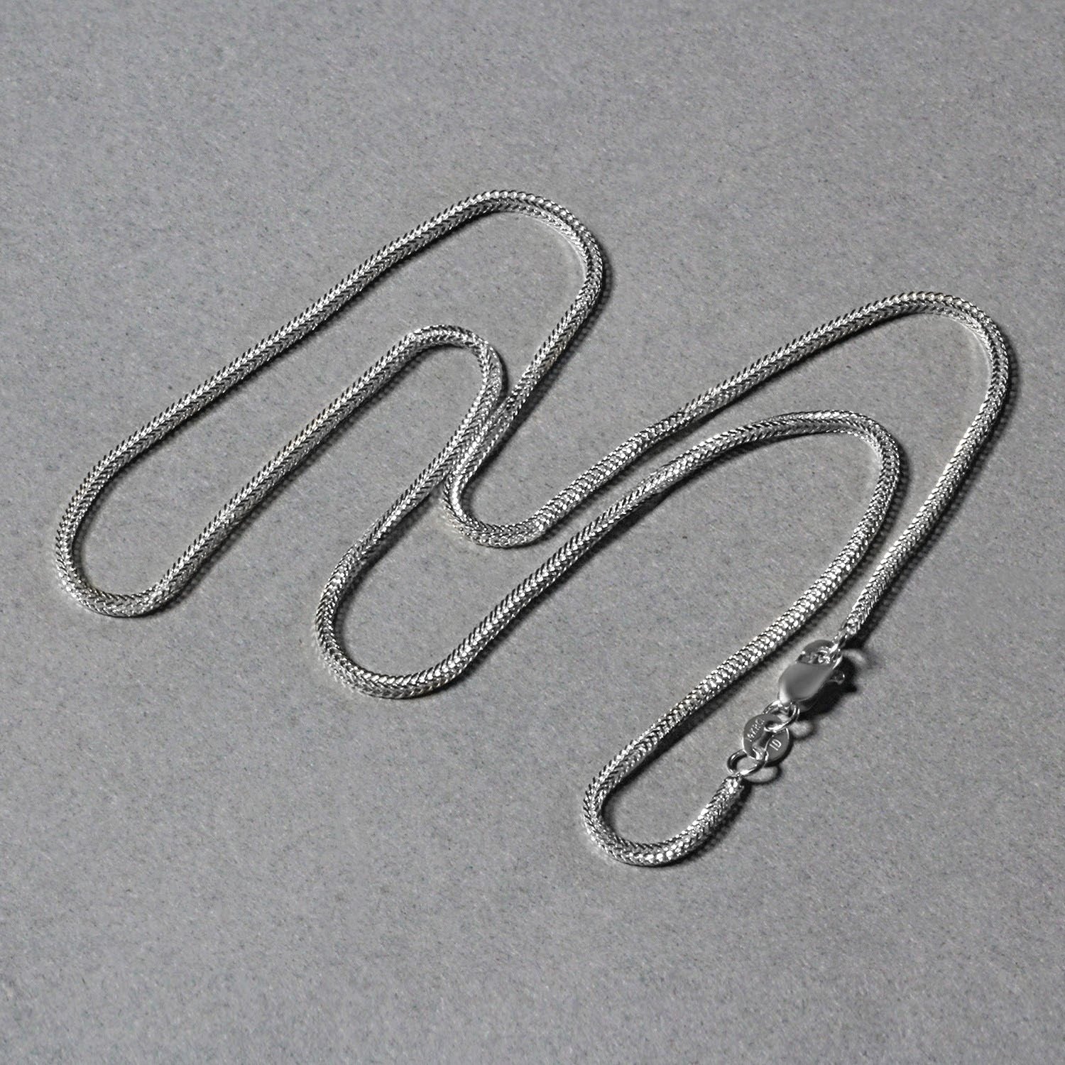 Elegant 14k white gold foxtail chain featuring a refined round design, perfect for layering or standalone wear.