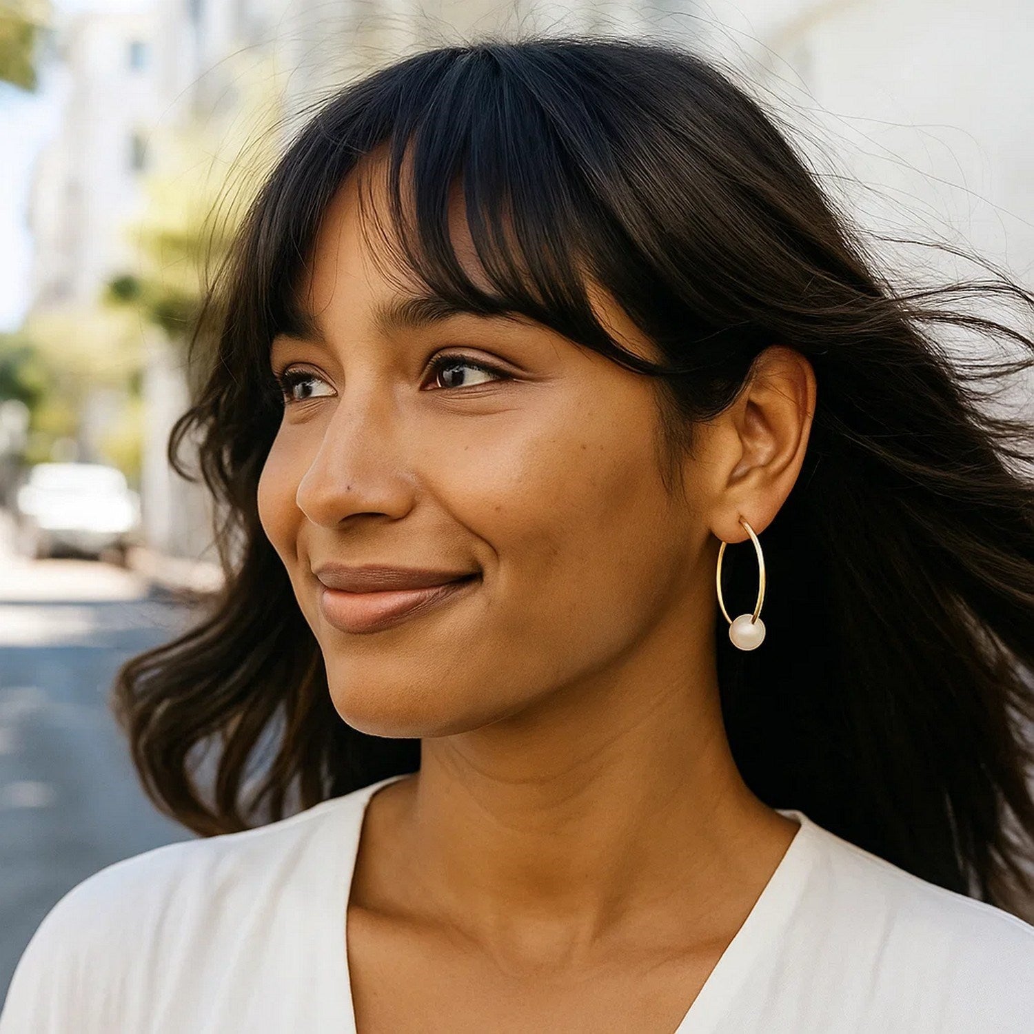 14k yellow gold endless pearl hoop earrings featuring elegant round design for a timeless luxury look.