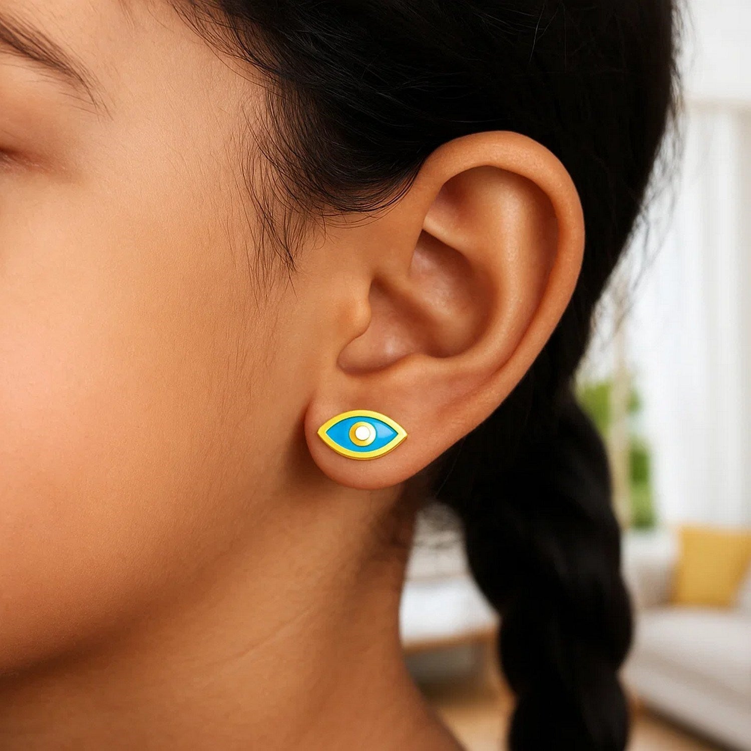 14k yellow gold dangle earrings featuring blue enamel evil eye design for a modern, luxurious touch.