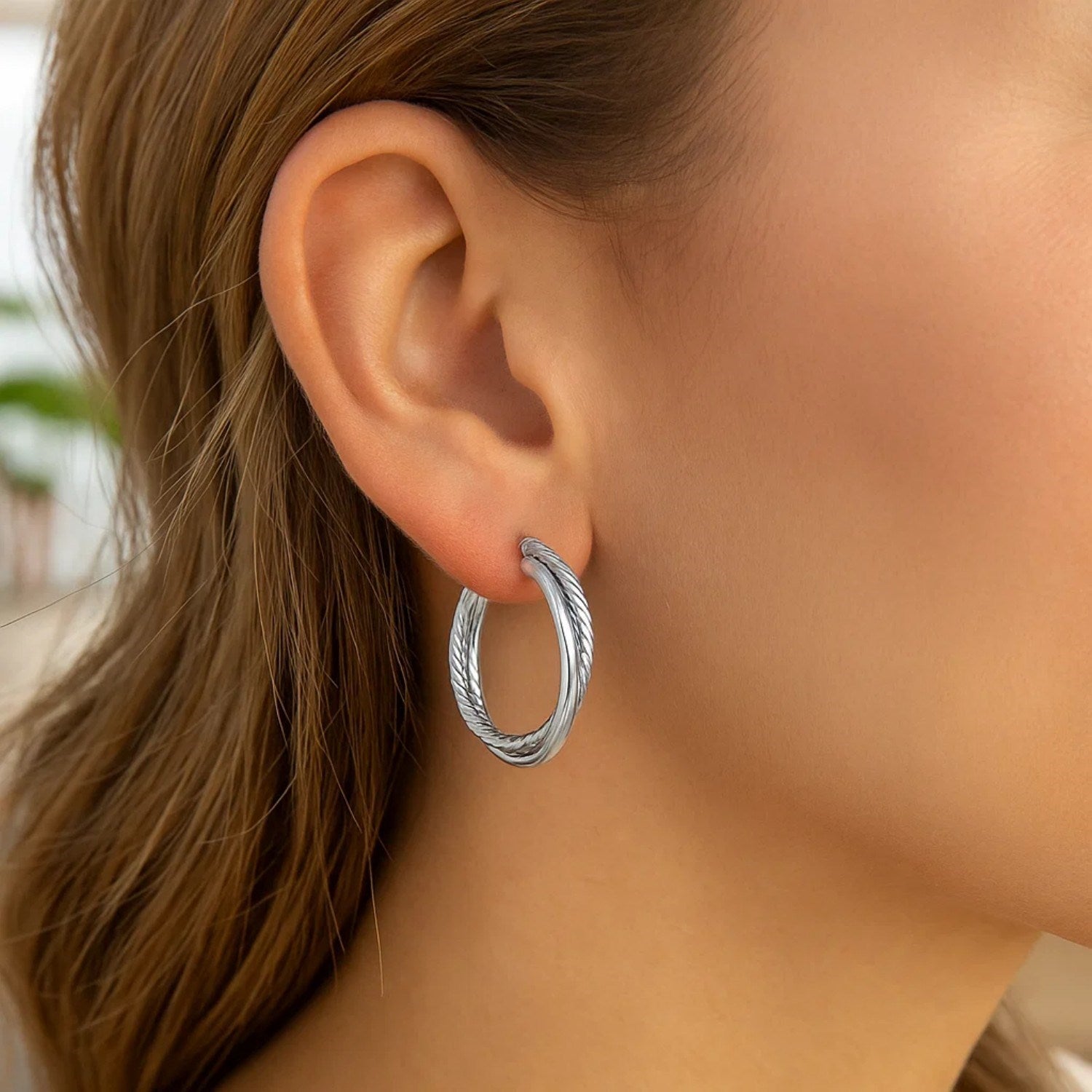 Sterling silver textured ridged hoop earrings, elegantly designed for a sophisticated look.