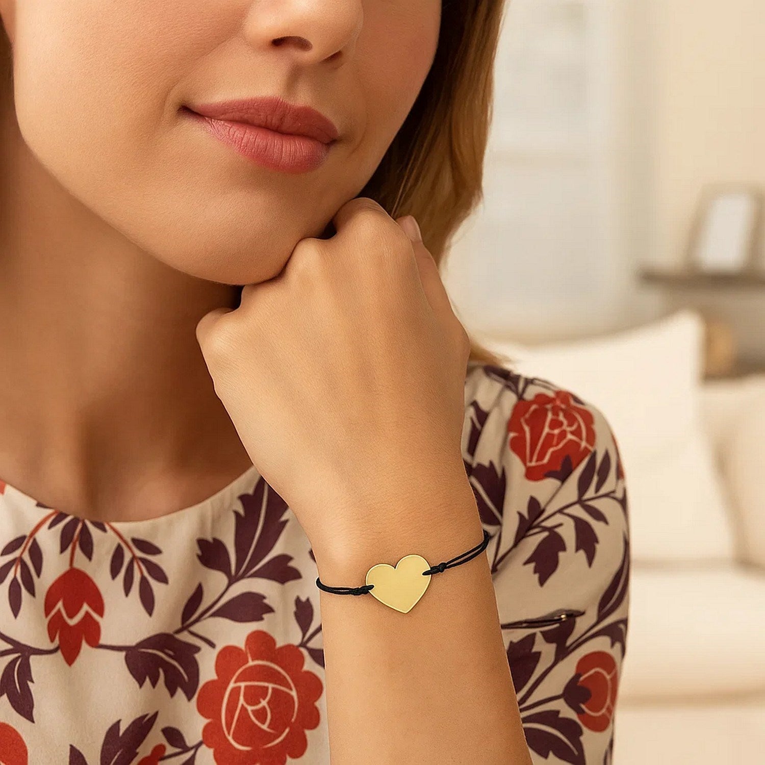 Elegant 9 1/4 inch black cord bracelet featuring a 14k yellow gold heart charm, perfect for luxury styling.