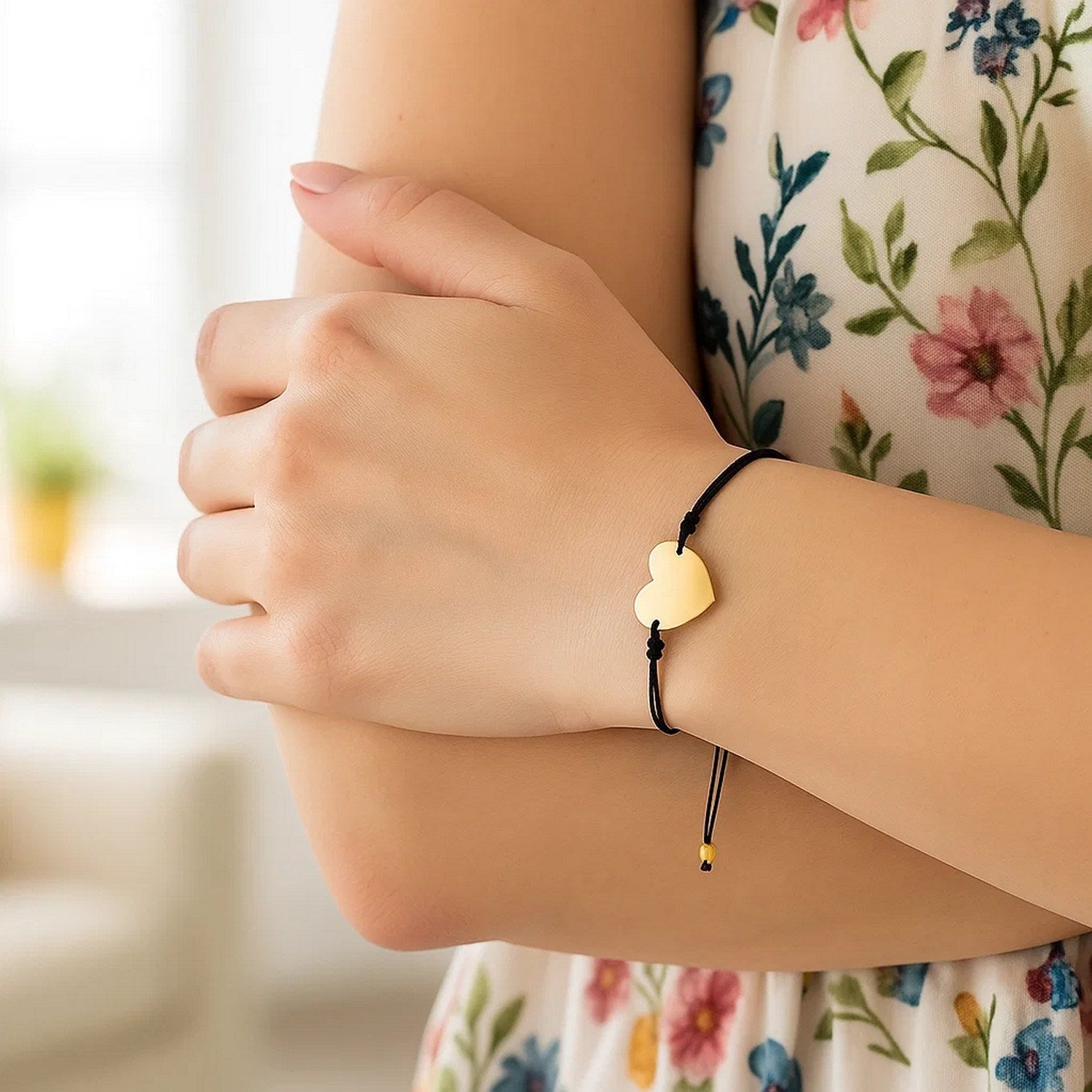 Elegant 9 1/4 inch adjustable bracelet featuring a 14k yellow gold heart on a luxurious black cord.