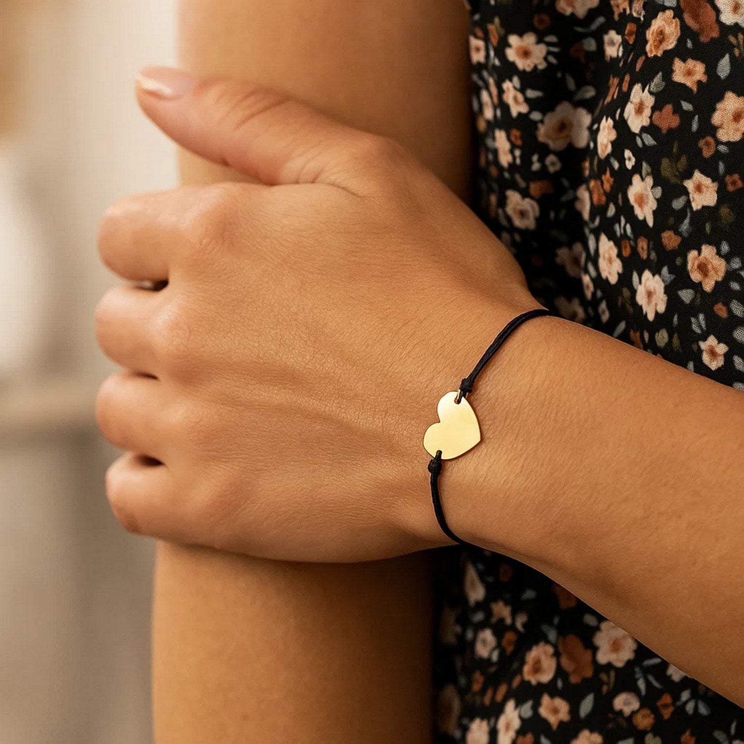 Elegant 9 1/4 inch adjustable bracelet featuring a 14k yellow gold heart on a luxurious black cord.