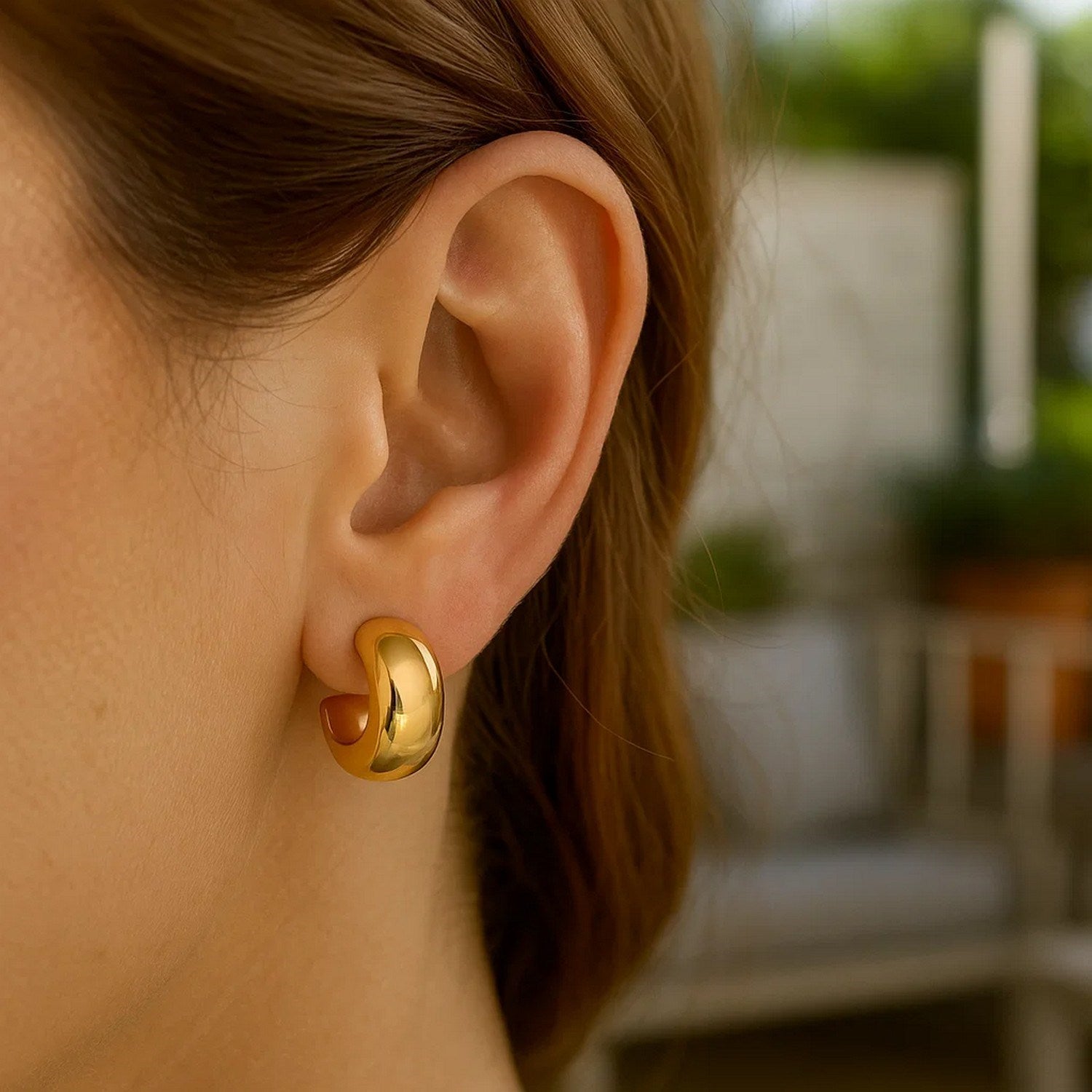 14k yellow gold polished hoop huggie earrings with a sleek, modern design for elegant everyday wear.
