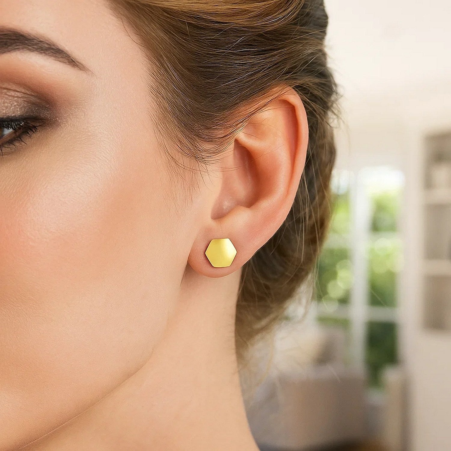 14k yellow gold modern hexagon stud earrings showcasing a sleek geometric design for a sophisticated look.