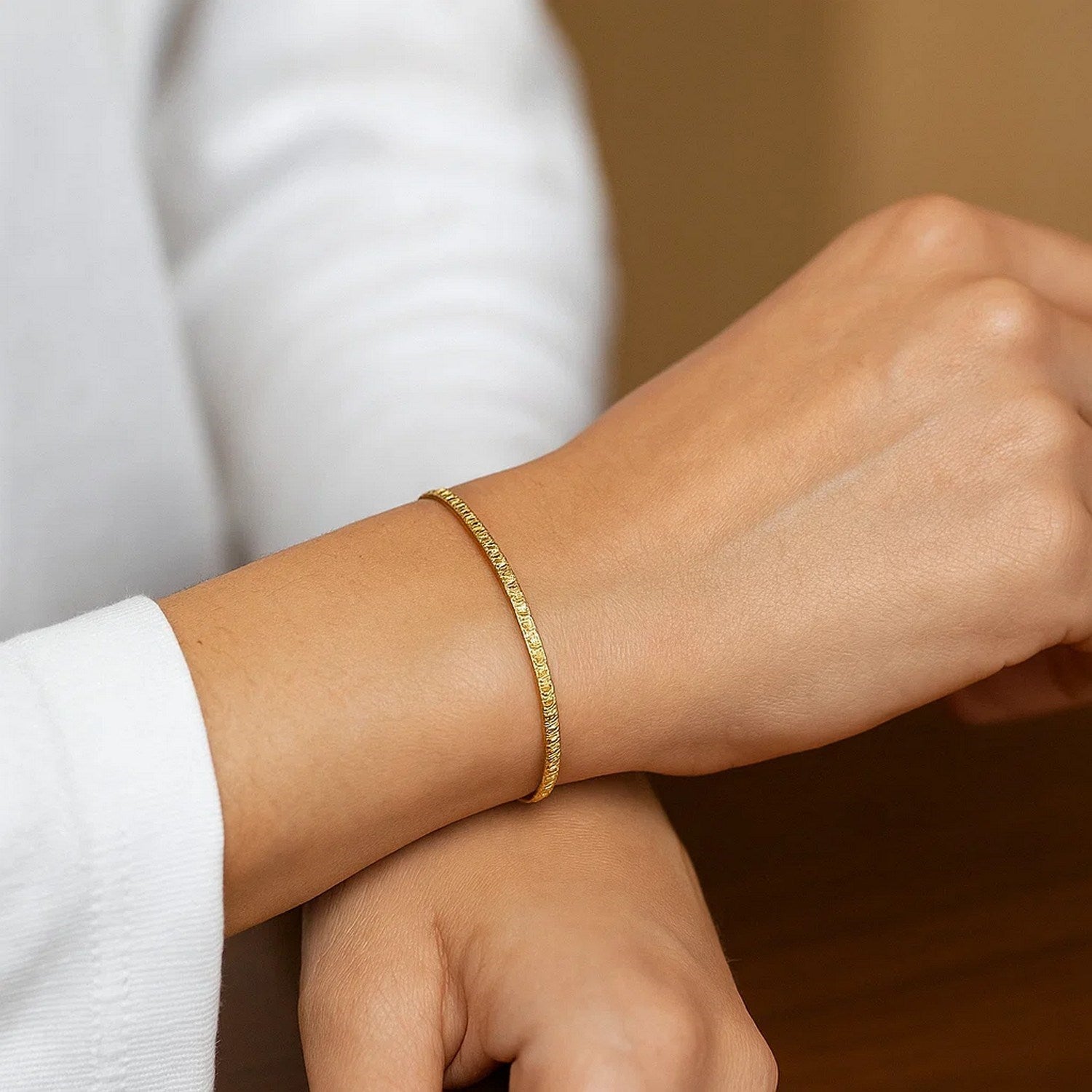 14k yellow gold mini glacier bracelet featuring delicate diamonds in a contemporary design, perfect for luxury styling.